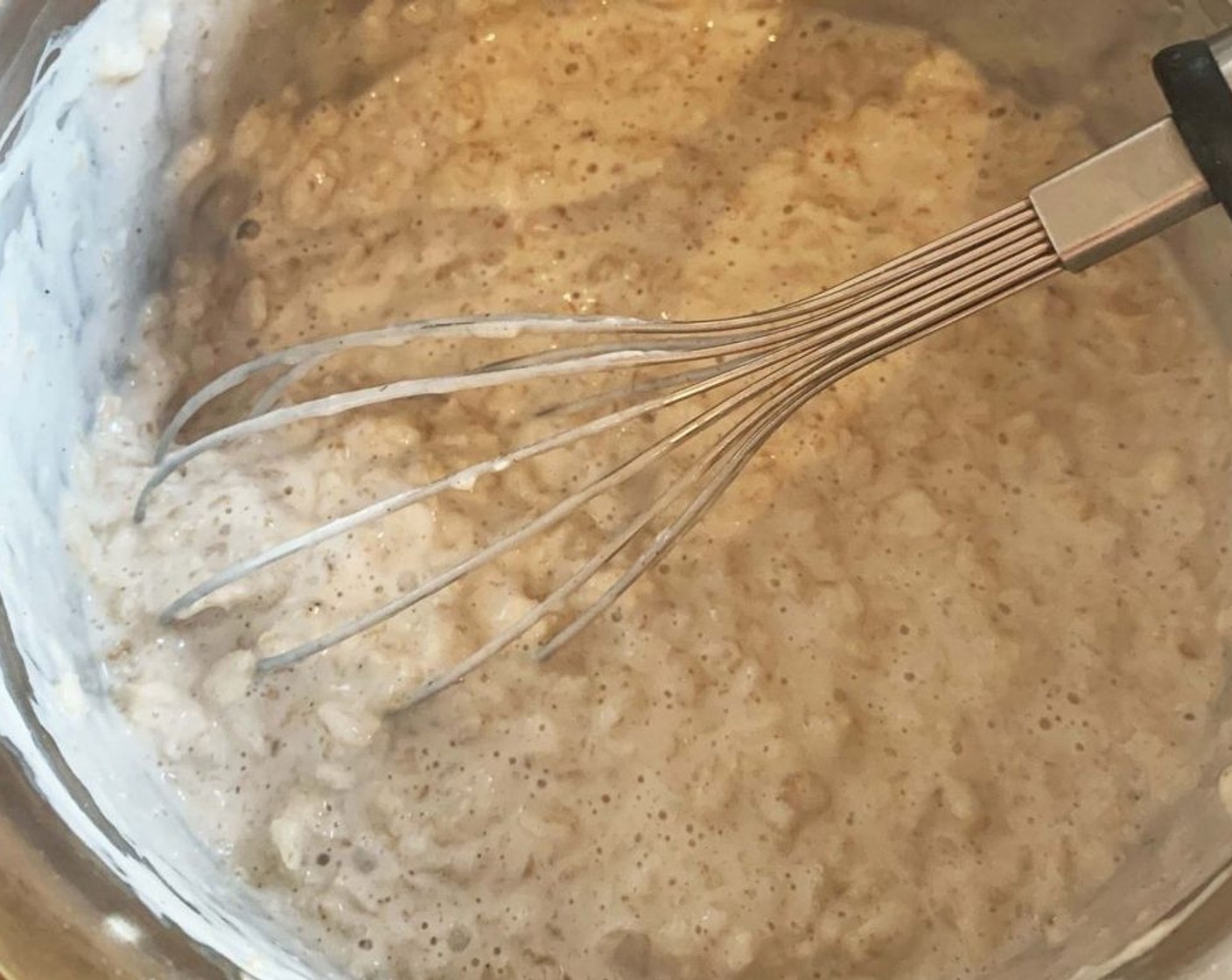 step 5 Add the Old Fashioned Rolled Oats (1 cup). Turn down to low heat, let the oats simmer while you stir with a whisk (about 10-15 min). When creamy, add the Almond Butter (1 Tbsp) and stir it in. Turn the heat off.