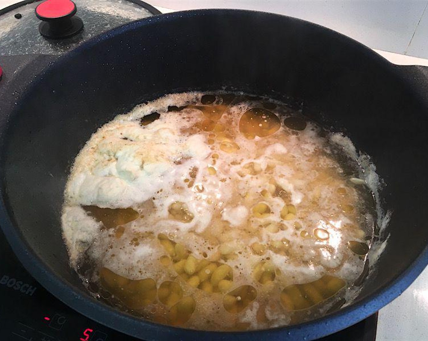 step 4 Bring to boil, skimming bean foam off top occasionally.