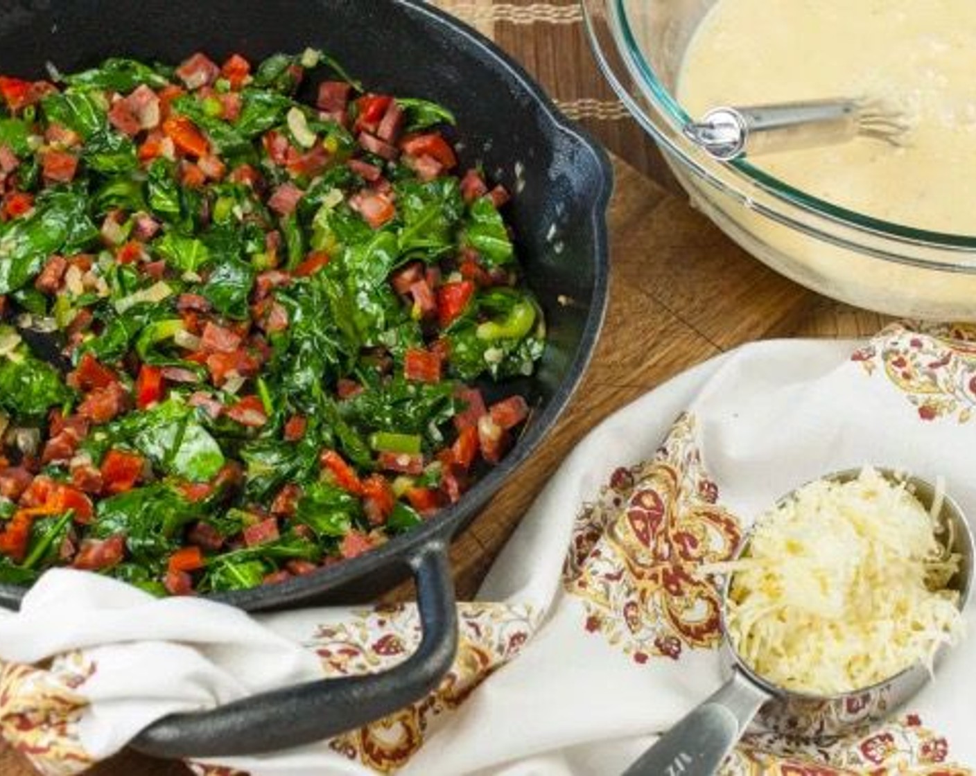 step 4 Stir in Fresh Spinach (4 cups), Roasted Red Peppers (1/3 cup), Fresh Oregano (1 Tbsp), and Italian Flat-Leaf Parsley (1 Tbsp), cooking until spinach has completely wilted, approximately 2 minutes.