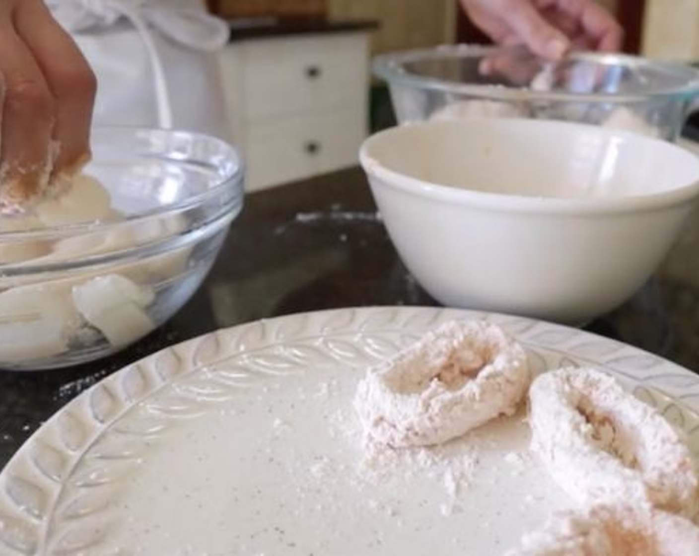 step 5 To coat each squid ring, add to the flour mixture first, then into the egg wash and then back into the flour. Do this until all the squid rings are coated.