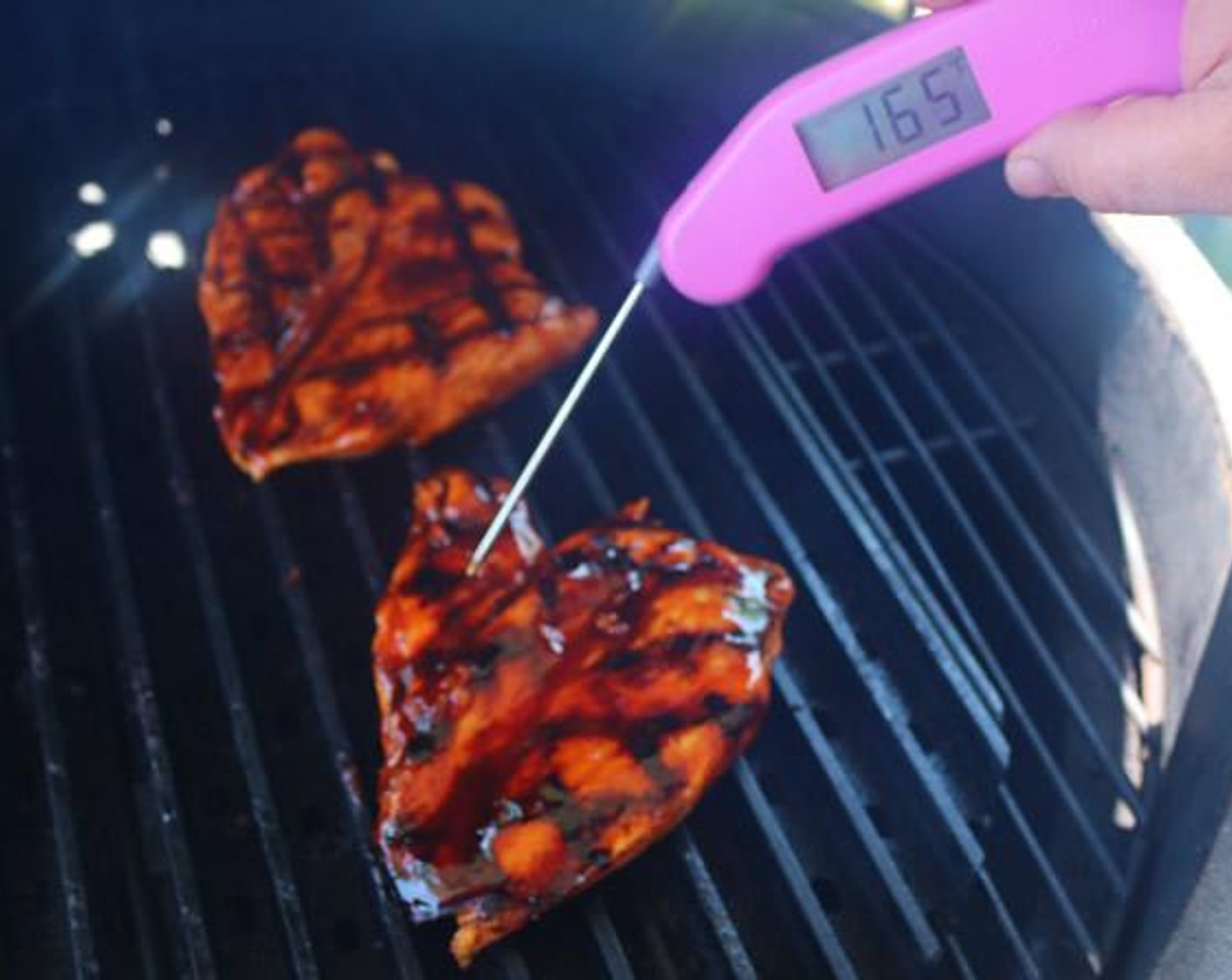 step 6 Flip chicken and brush with BBQ Glaze. Continue to cook until internal temperature reaches 165 degrees F (74 degrees C) on an instant read thermometer, about 6 more minutes.