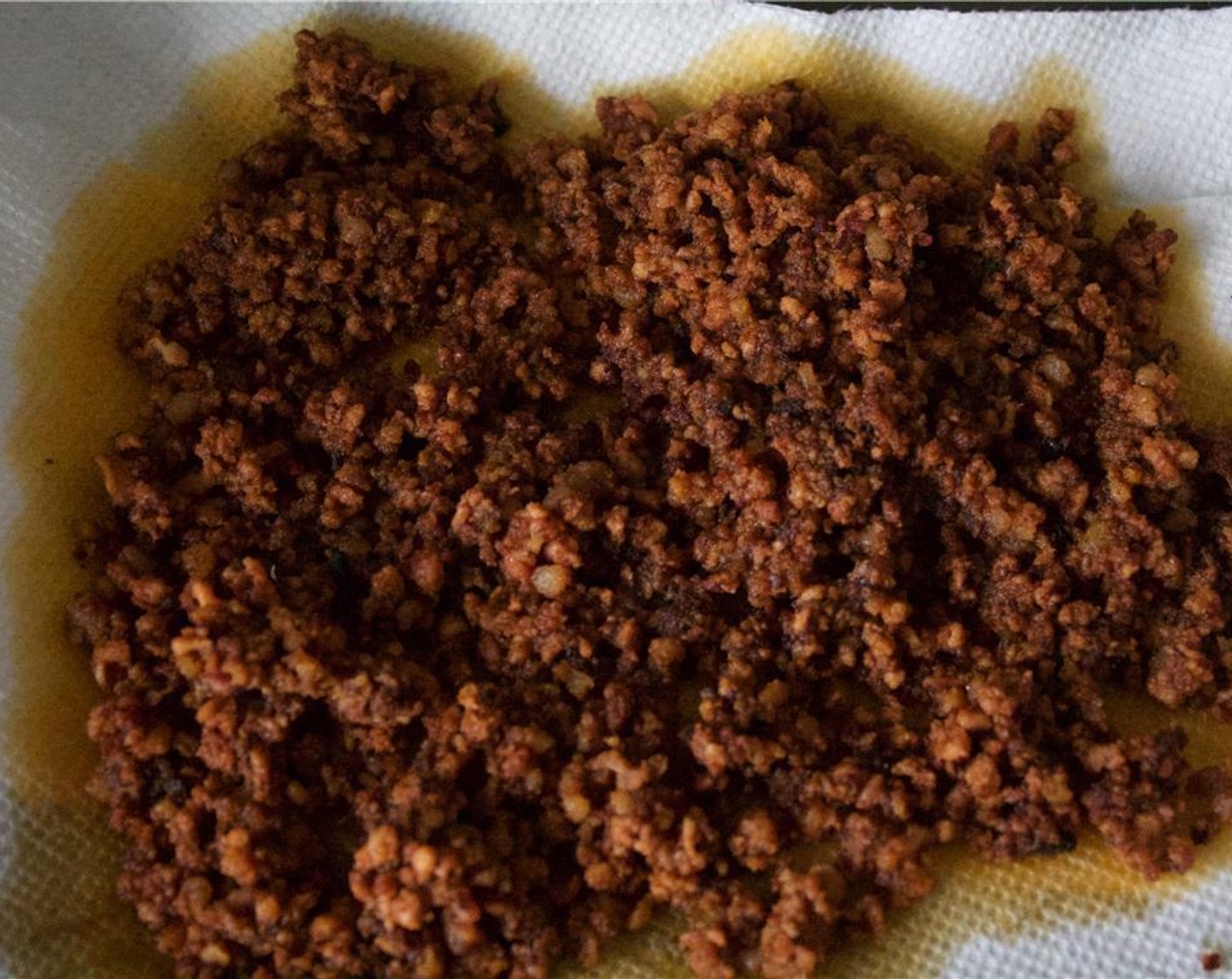 step 5 Use a slotted spoon to remove the chorizo to a paper towel lined plate and set aside.