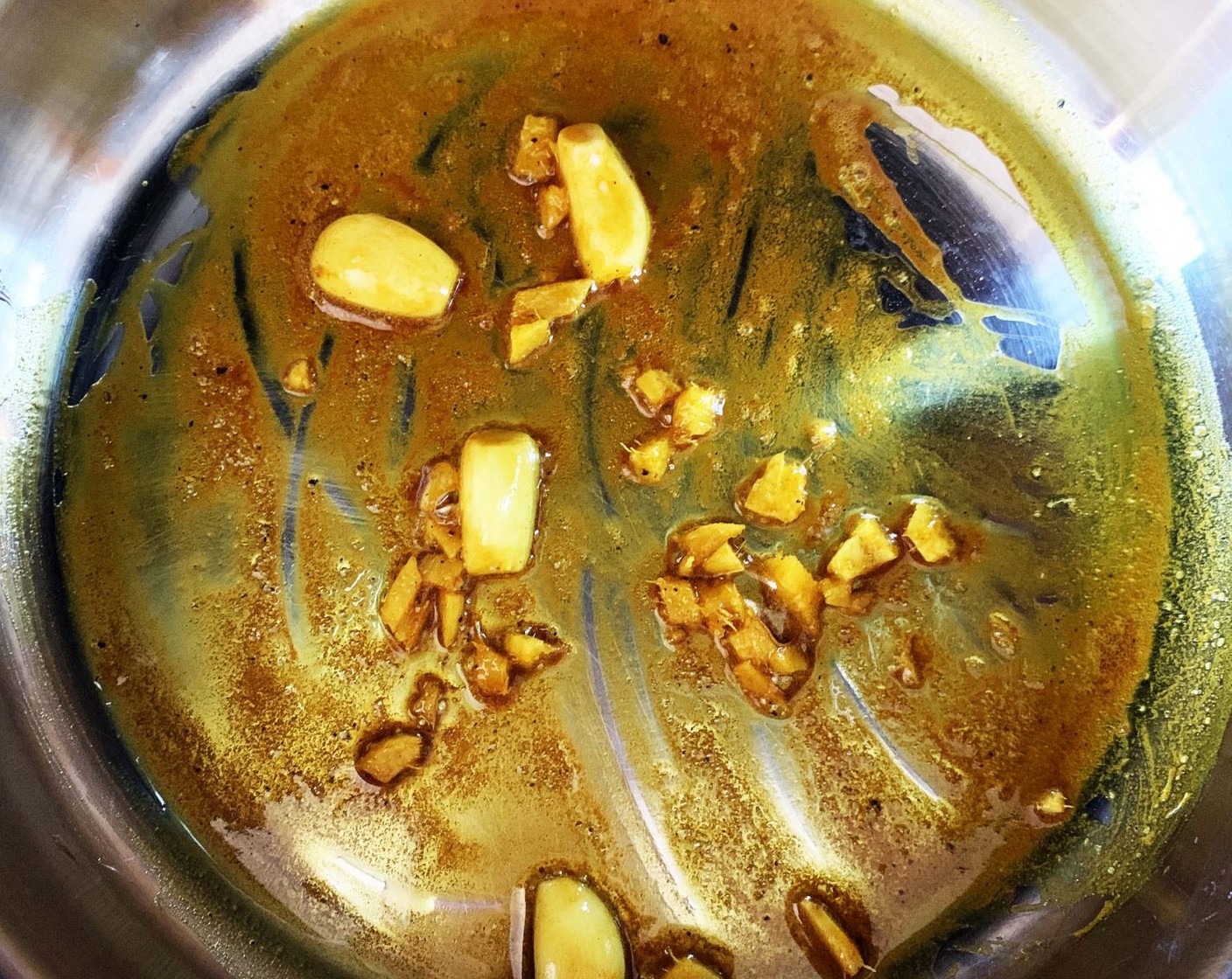 step 1 In a skillet heat up the Extra-Virgin Olive Oil (2 Tbsp), then add the Garlic (2 cloves), Ground Turmeric (1 tsp), and Fresh Ginger (1 piece). Sauté for a few minutes.