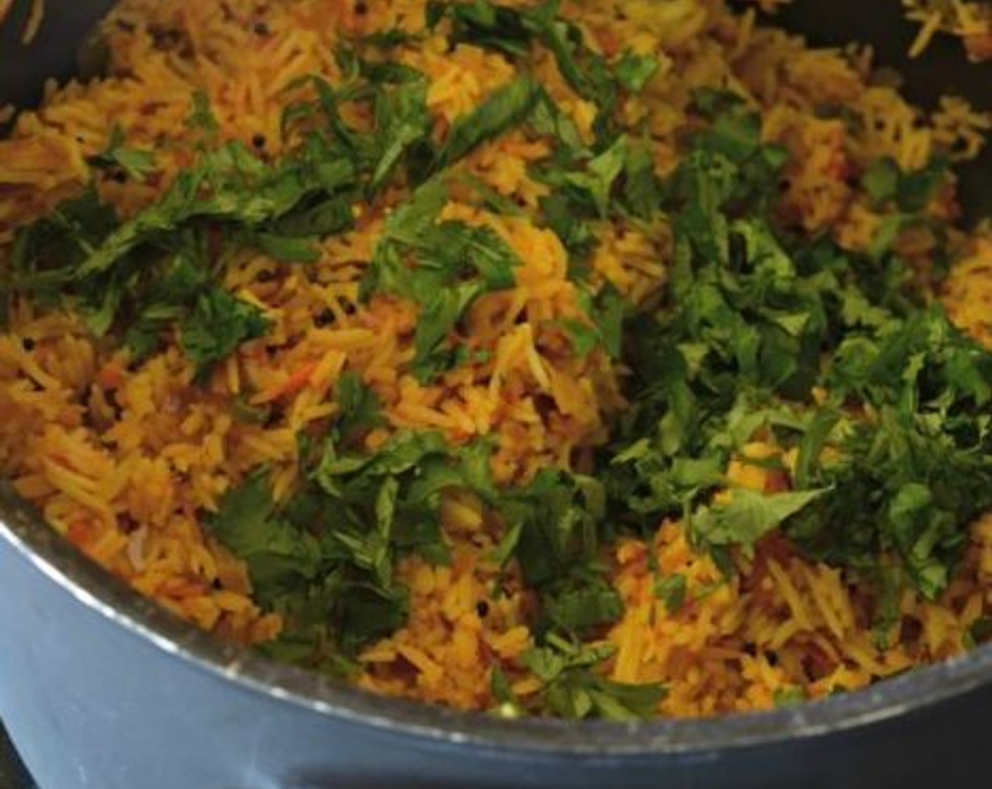 step 4 Then add the cooked Basmati Rice (2 1/2 Tbsp). Mix it all together and cook for a minute or two. Lastly, garnish it chopped Fresh Cilantro (1/2 cup).