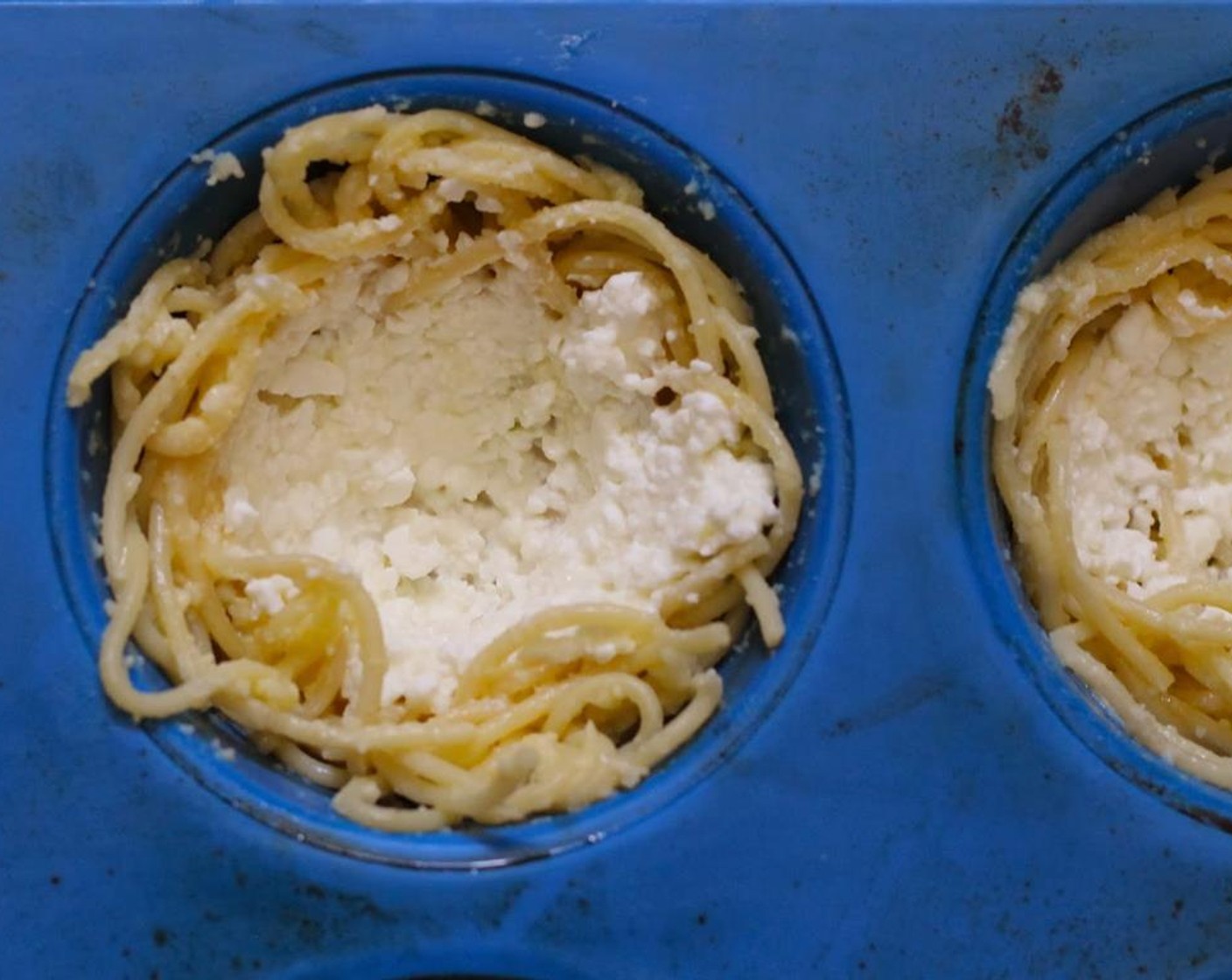 step 8 Spread cheese mixture over the inside of spaghetti nests.