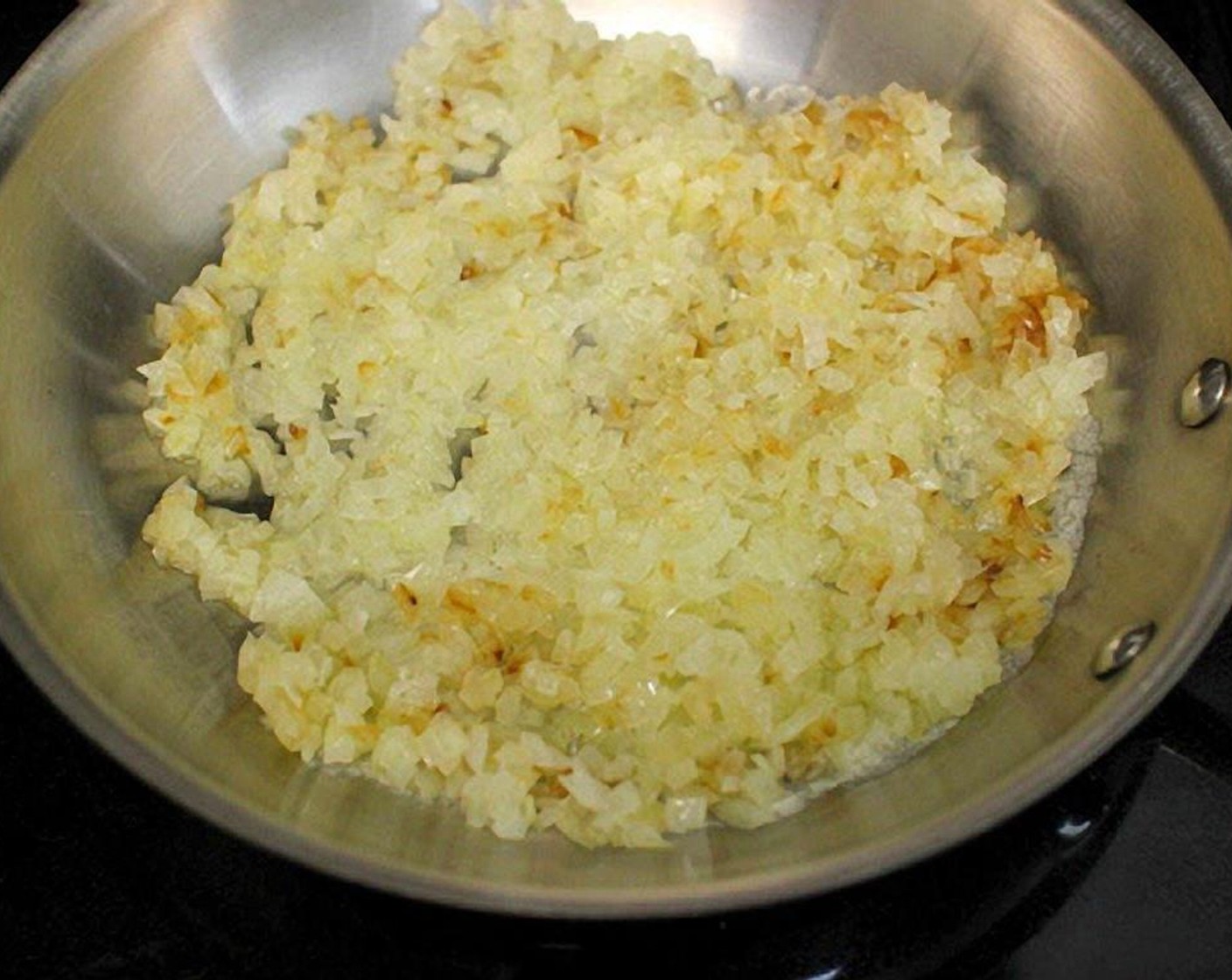 step 2 Melt the Butter (1 1/2 Tbsp) in a skillet. Add the Onions (2), season with Salt (to taste) and Ground Black Pepper (to taste), cover and cook on medium heat until tender, about 5 minutes.