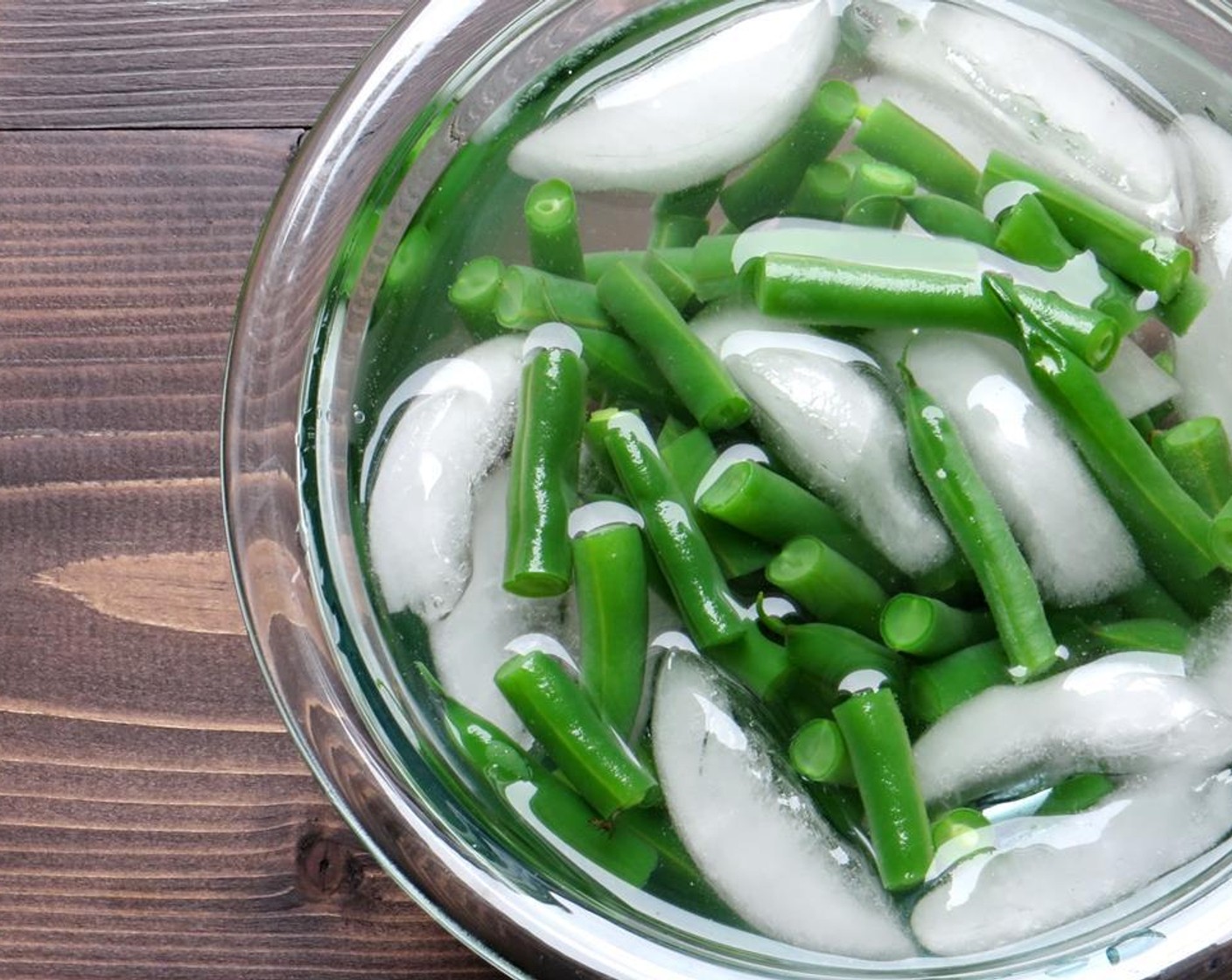 step 2 Fill a medium saucepan halfway with water. Add a teaspoon of Kosher Salt (1 tsp) and fit the pan with a lid. Bring to a boil over high heat. Remove the lid and add the Green Beans (2 cups). Cook the beans for 4-5 minutes until crisp tender. Use a spider or slotted spoon to scoop the beans from the water and plunge them into the ice bath to stop the cooking. Set aside.