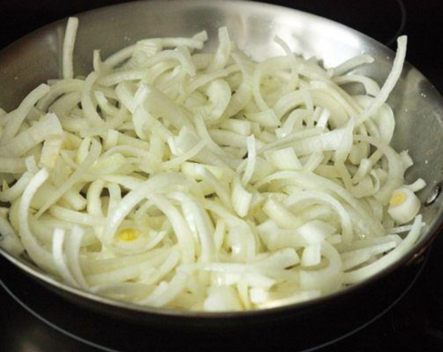step 2 Melt 2 tablespoons of Unsalted Butter (2 Tbsp) in a large frying pan over medium heat. Once butter has melted, add the onions and Salt (1 tsp) and toss well. Cook onions over medium for about 30 minutes, stirring often to caramelize all the onions.