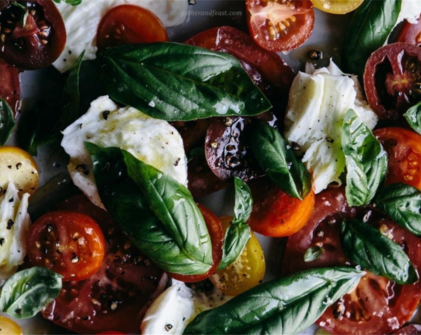 step 2 Tear up the lovely Buffalo Mozzarella Balls (2 cups) and place it over the tomatoes. Pick the fresh Fresh Basil (1 bunch) off their stems and scatter them over the tomatoes and mozzarella.