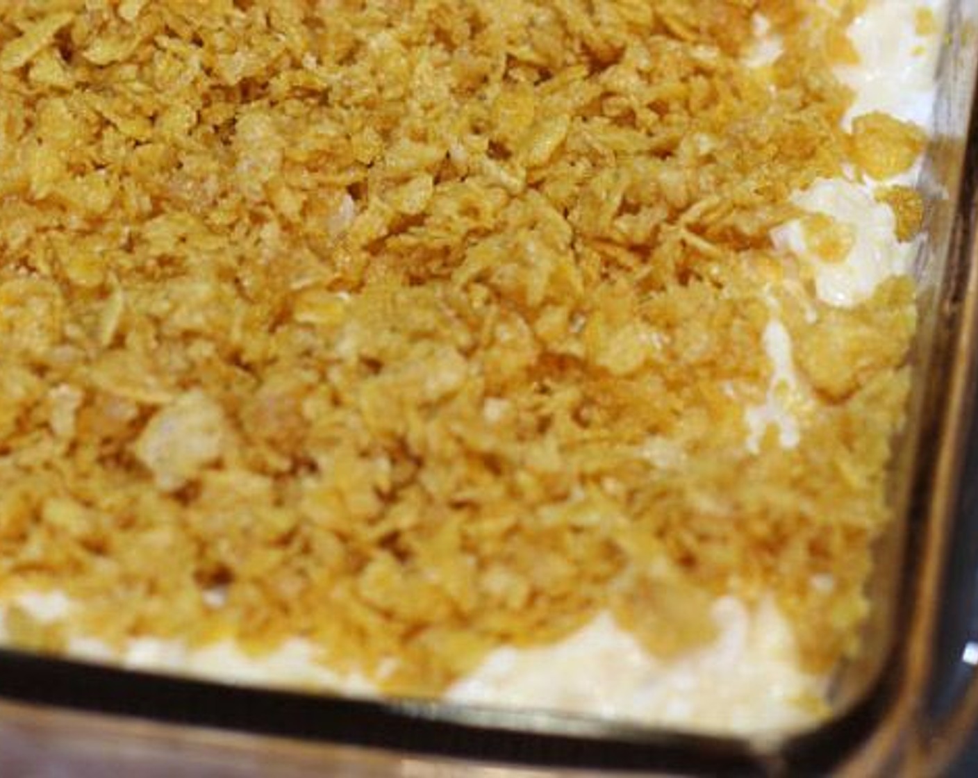 step 6 In a small bowl, combine the Unsalted Butter (1/3 cup), Corn Flakes (3 cups), Grated Parmesan Cheese (4 Tbsp), and Smoked Paprika (2 tsp). Stir gently until the topping is evenly coated and crumbly. Sprinkle evenly over top of potato mixture.