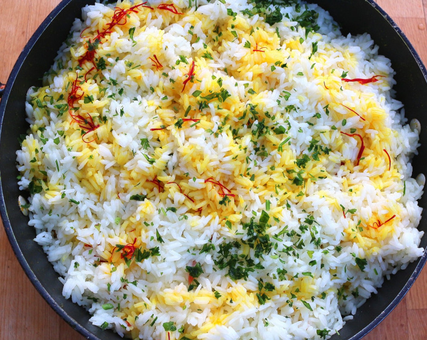 step 12 Repeat with the other half of the rice, the other half of the saffron milk, then sprinkle with the remaining Garam Masala (1 tsp), Fresh Cilantro (1 Tbsp), and Fresh Mint Leaves (1/2 tsp).