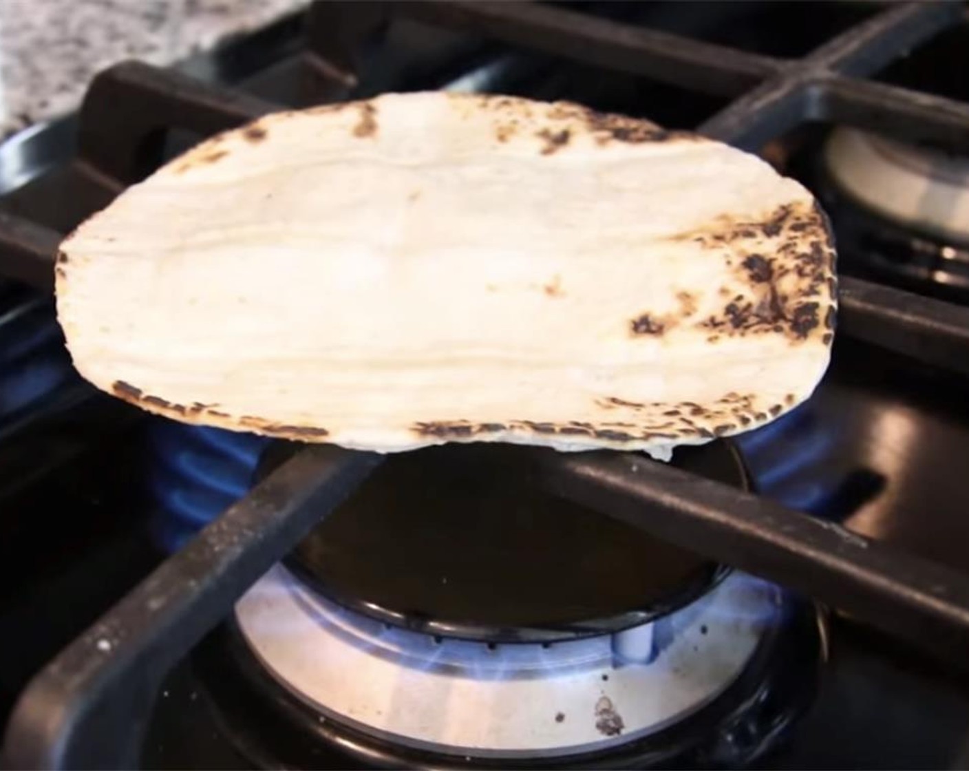 step 8 Toast your White Corn Tortillas (12) on both sides directly on the gas flame and then wrap them in tin foil to keep warm.