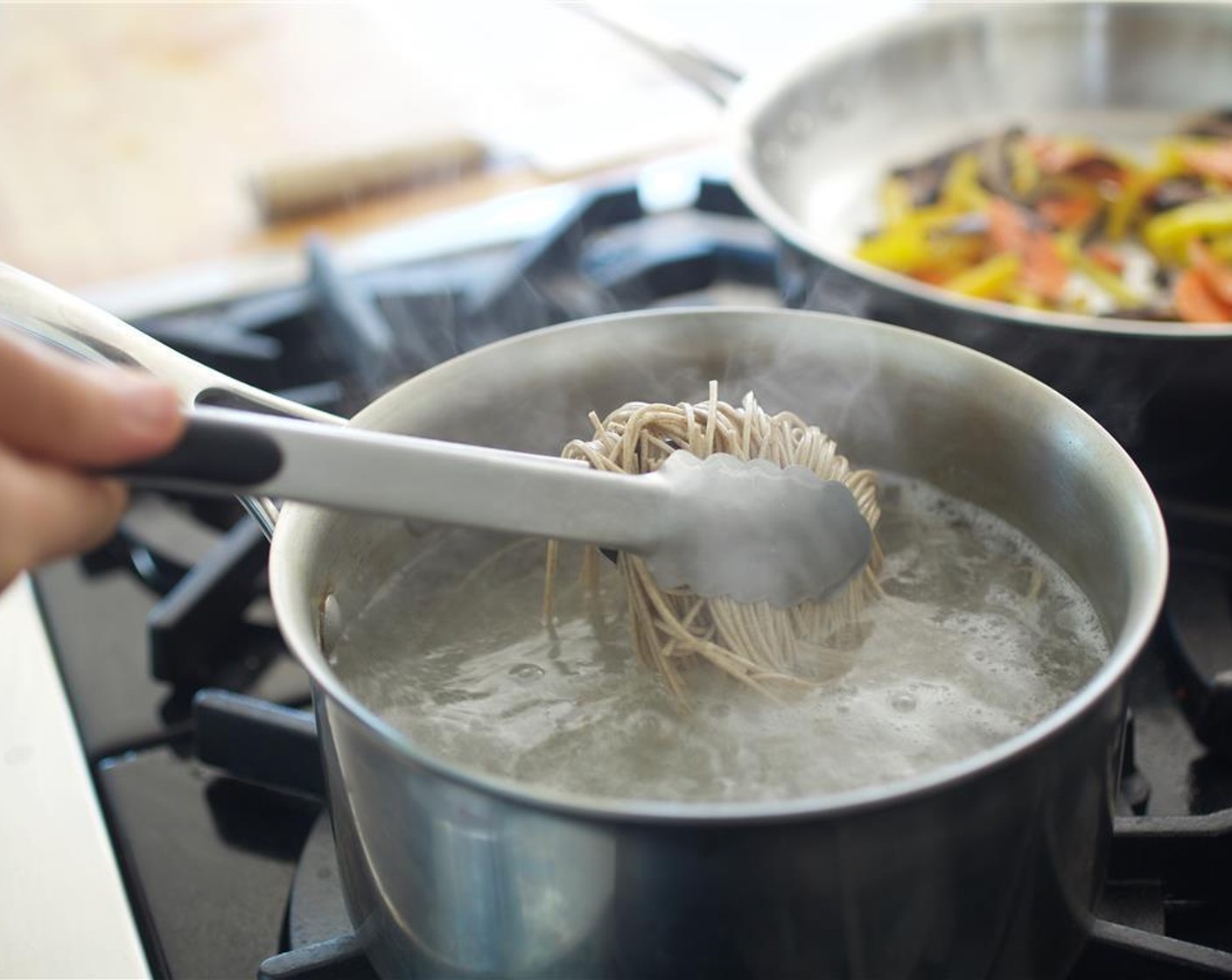 step 6 Add the Soba Noodles (3 oz) to the boiling water and cook for four minutes.