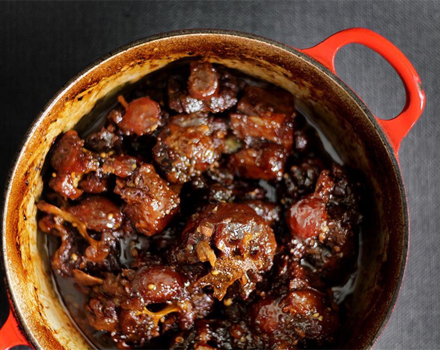 step 10 Return the oxtail back into the pot, and return it to the stove over HIGH heat. Add Rice Vinegar (1 tsp) and reduce the sauce SLIGHTLY, just until the oxtail are coated in a shiny sheen.