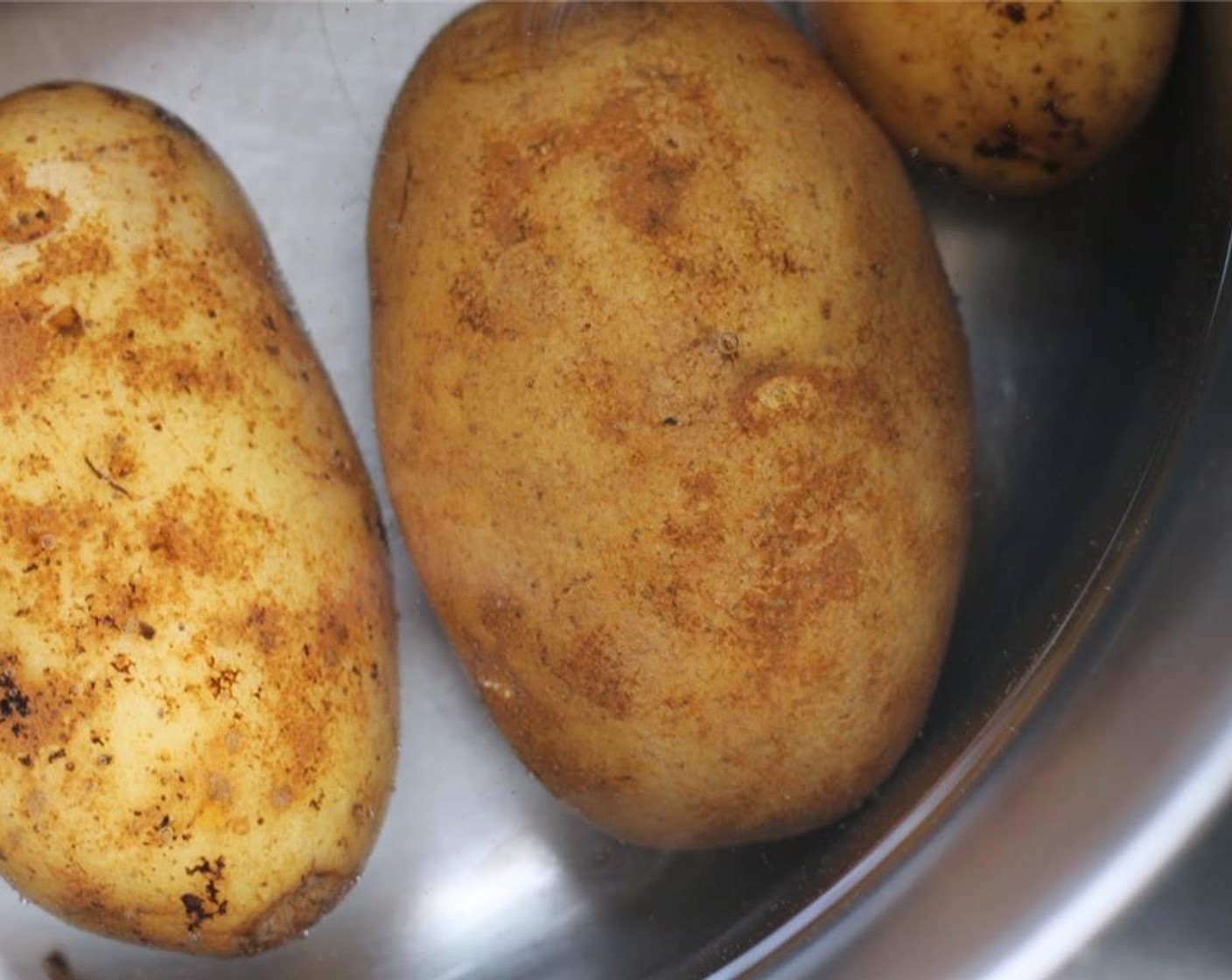 step 1 Preheat oven to 350 degrees F (180 degrees C). Boil Potatoes (6) and allow them to cool completely.
