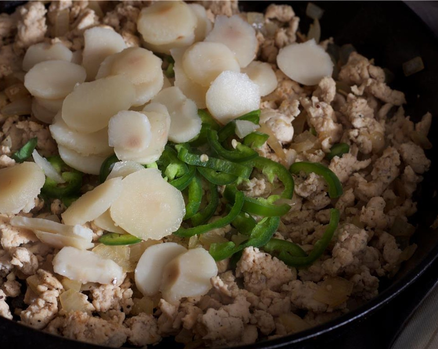 step 5 Drain and add in the Water Chestnuts (1 3/4 cups) and Jalapeño Pepper (1). Stir in the sauce and cook for a minute.