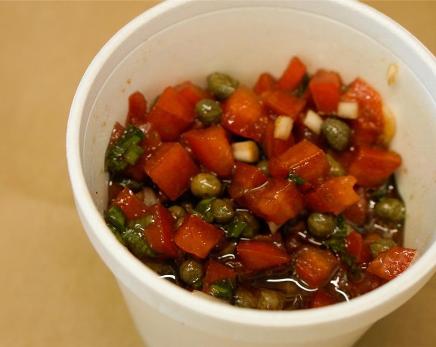 step 2 To make the salsa, combine the tomatoes (1/2 cup), red onion (1/8 cup), Capers (2 Tbsp), chives (1 tsp), Balsamic Vinegar (1/4 cup), and a little of the Salt (1 pinch) and Ground White Pepper (1 pinch).  Refrigerate.