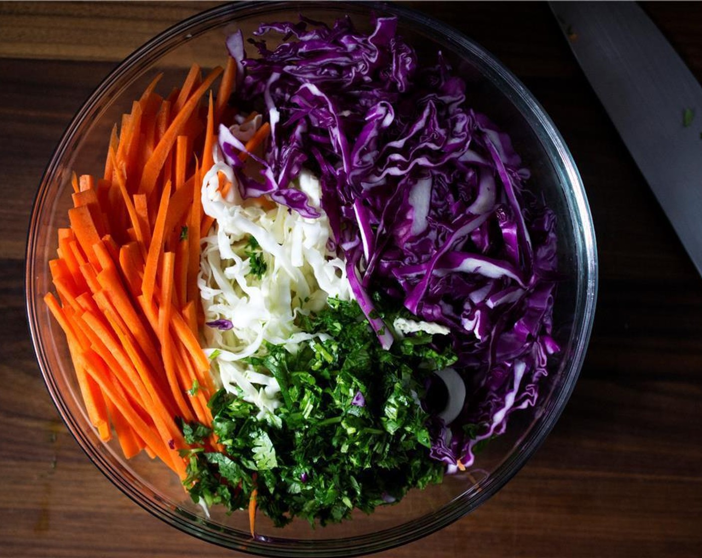 step 1 In a large mixing bowl, add Red Cabbage (1 cup), Green Cabbage (1 cup), Carrots (2), and Fresh Cilantro (1/2 cup).