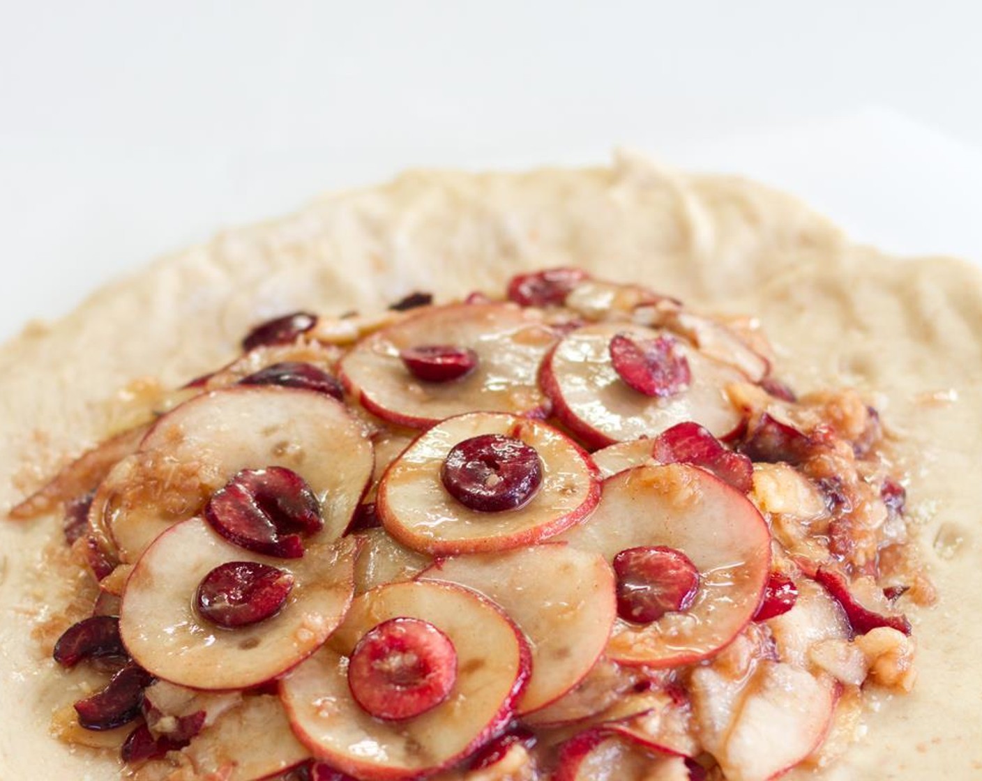 step 5 Place the combined fruit onto the almond flour dusted pastry, again leaving the border free of fruit.