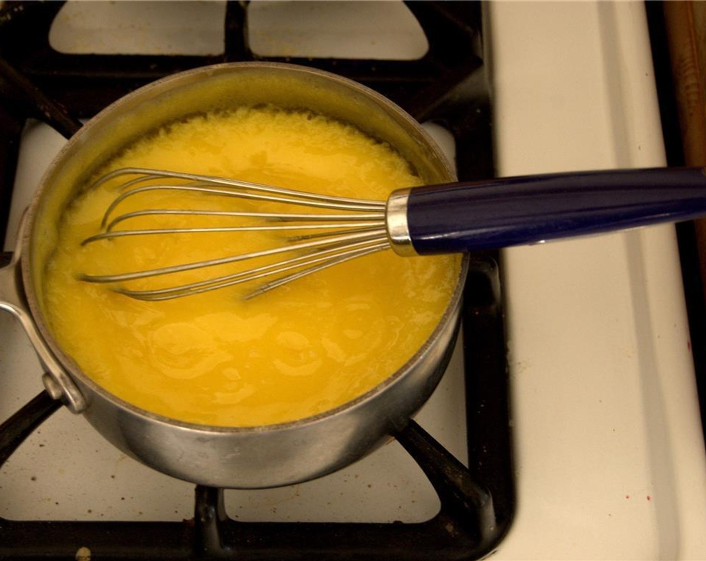 step 1 Whisk Whipping Cream (3/4 cup), Granulated Sugar (3/4 cup) and the yolks of the Eggs (5) in a heavy bottom medium-sized​saucepan​n. Stir to blend.