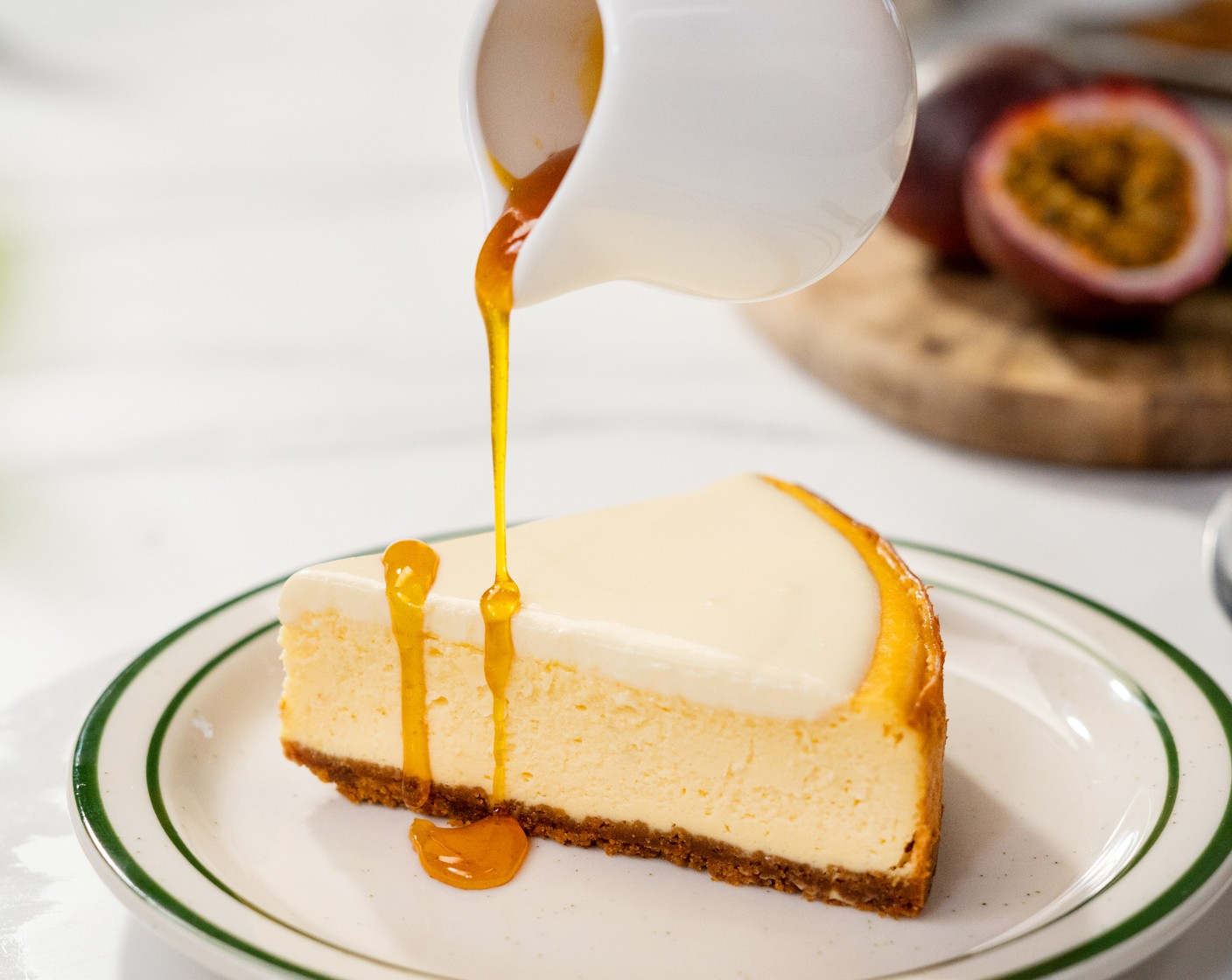 step 12 Bring the cheesecake out of the fridge. Slice, and serve with the passion fruit topping sauce.