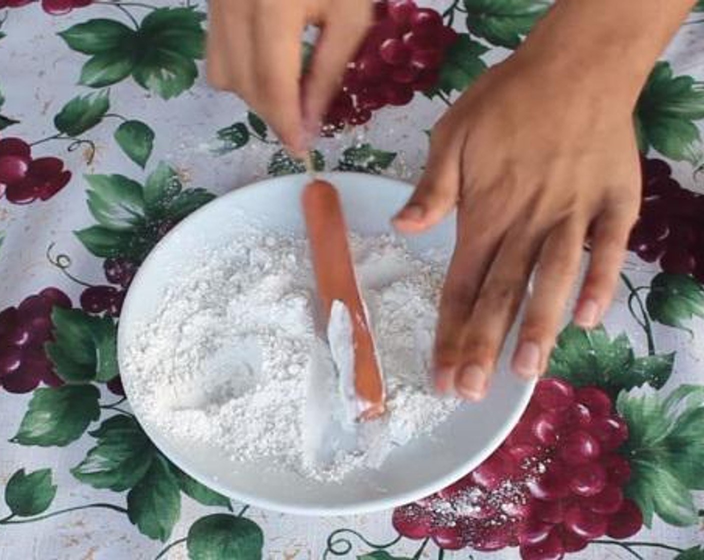 step 3 Insert a skewer through each Hot Dog (1 pckg).  Then, roll each hot dog over the extra All-Purpose Flour (to taste), and set aside.