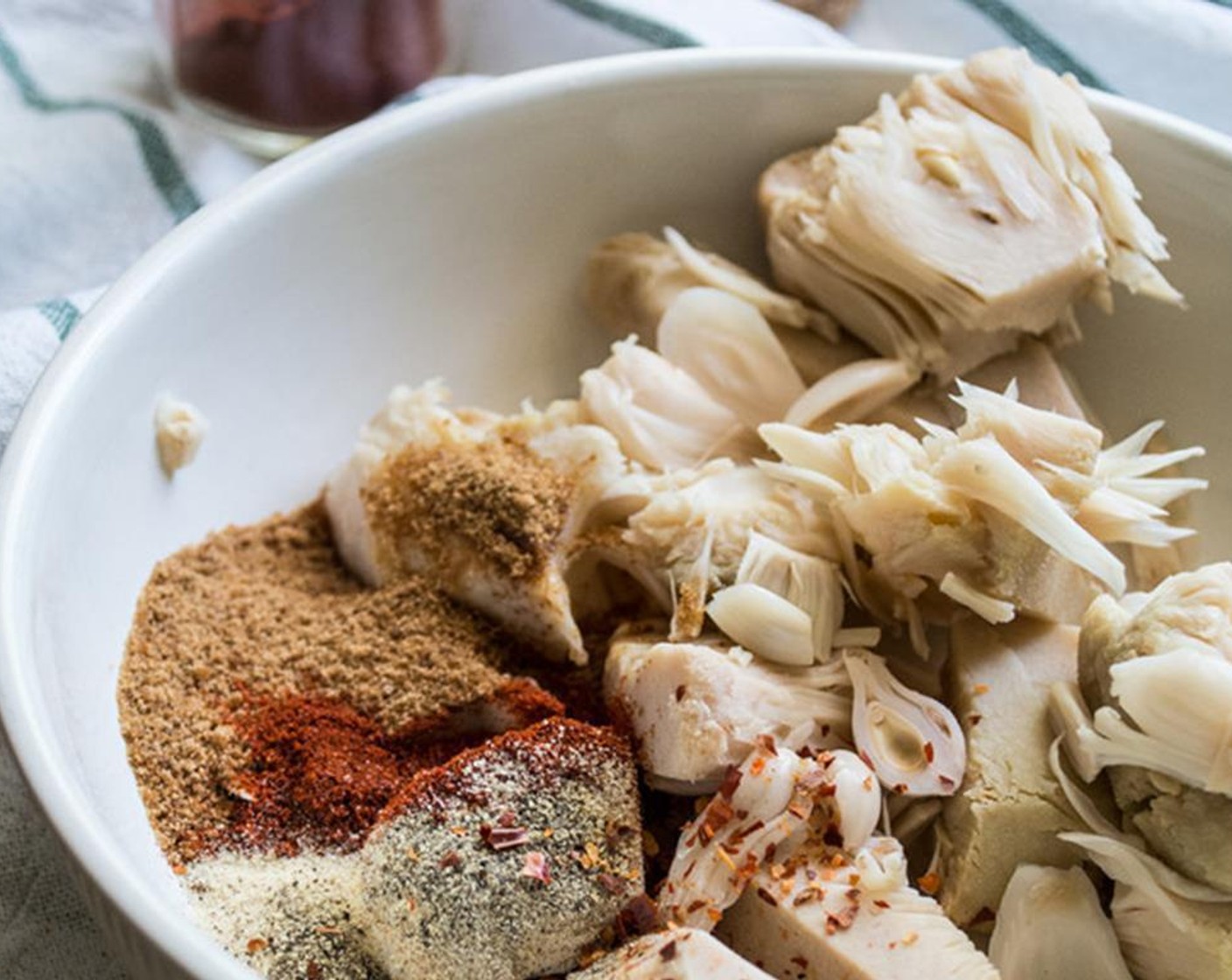 step 2 In a bowl, mix dried jackfruit, Coconut Sugar (1 Tbsp), Smoked Paprika (1/2 tsp), McCormick® Garlic Powder (1/2 tsp), Freshly Ground Black Pepper (1/2 tsp), and Crushed Red Pepper Flakes (1/4 tsp) until well combined. Use clean hands or forks to pull apart bigger pieces.