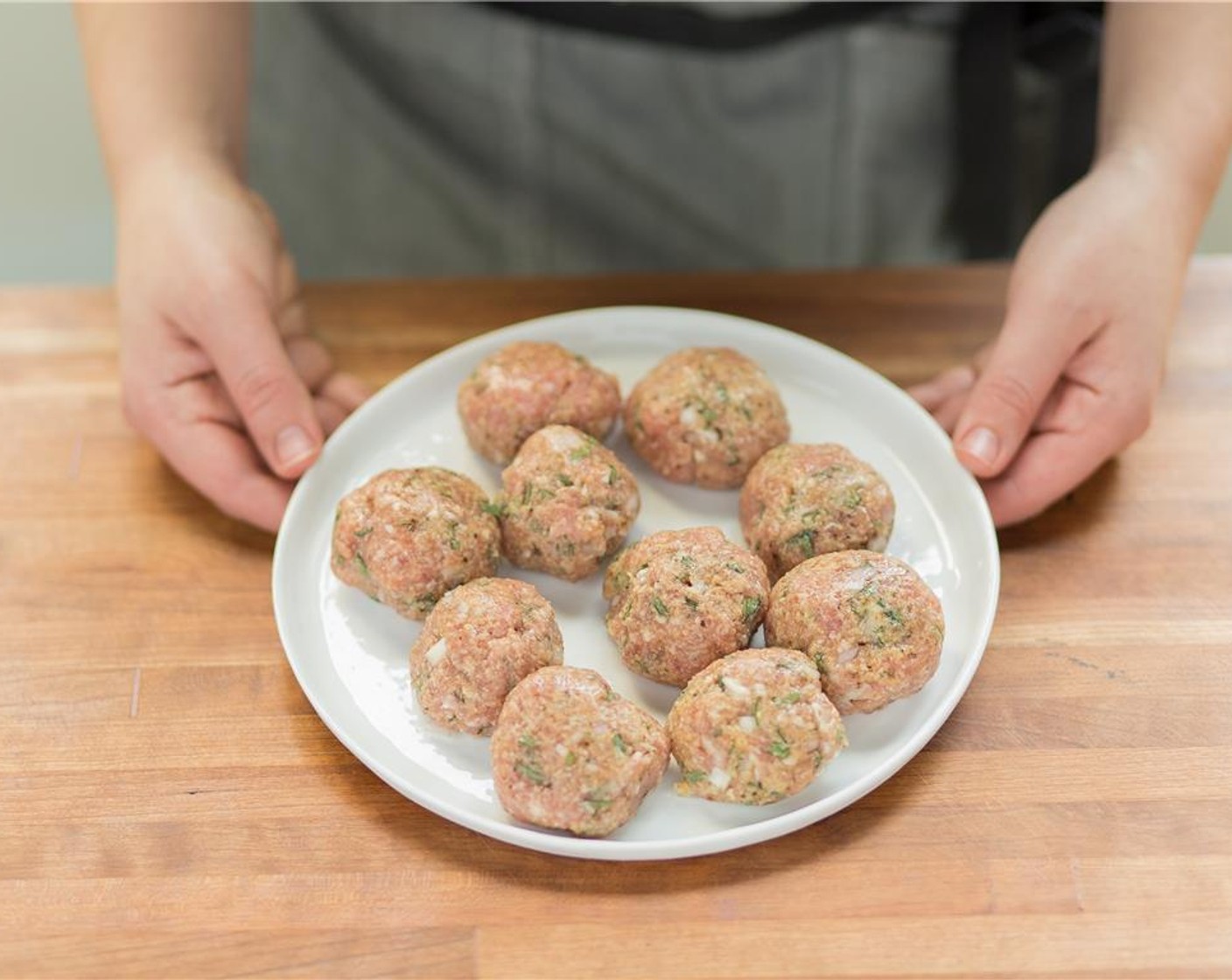 step 4 Form ten, golf ball sized meatballs and set aside on a plate.