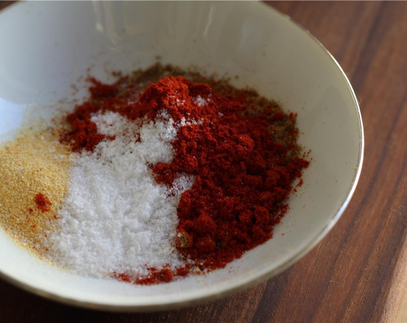 step 1 Combine the McCormick® Garlic Powder (1/2 Tbsp), Chili Powder (1 tsp), Ground Cumin (1/2 Tbsp), Smoked Paprika (1 tsp), Ground Coriander (1 tsp), and Salt (1/2 Tbsp) in a small bowl.