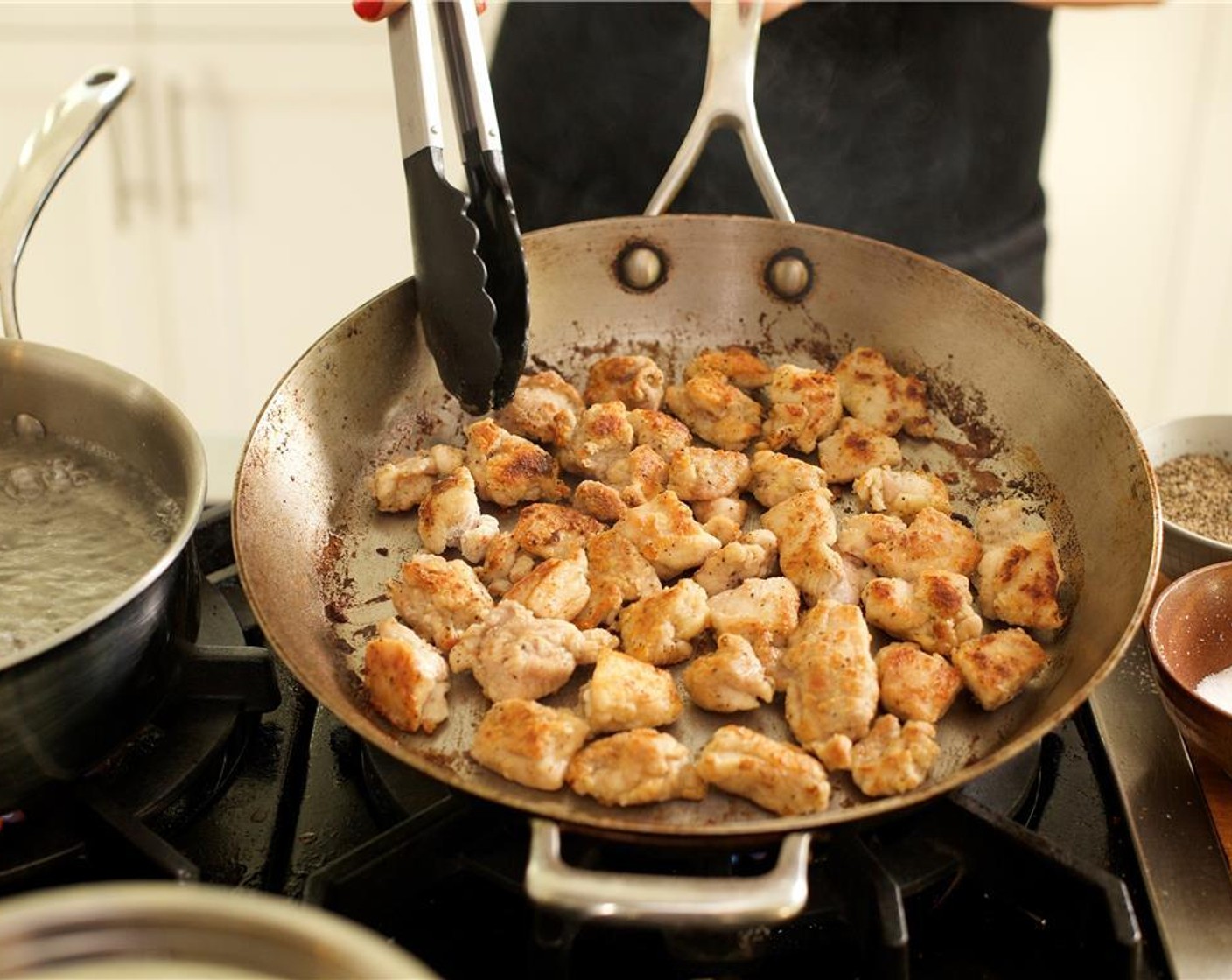 step 14 Once pan is hot, add chicken and saute for ten minutes, stirring frequently.