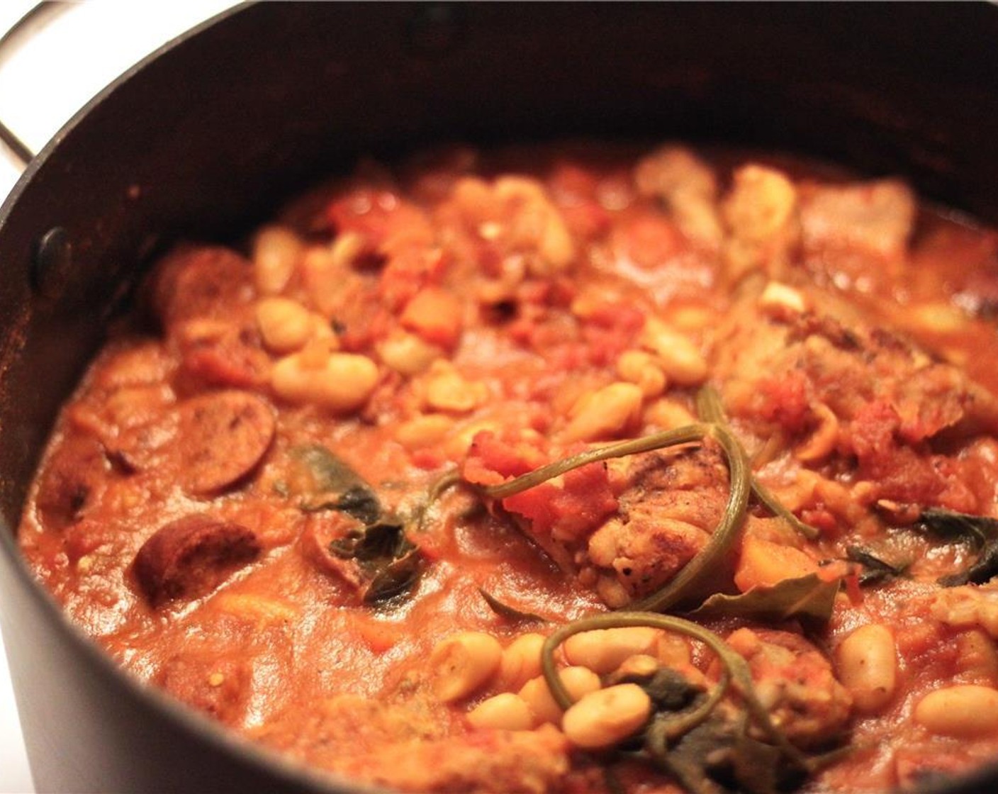 step 10 Bring to a boil, then reduce heat and allow to simmer about 20 minutes. Stir occasionally until the cassoulet thickens up a bit and remove from the heat to allow it to thicken even more.