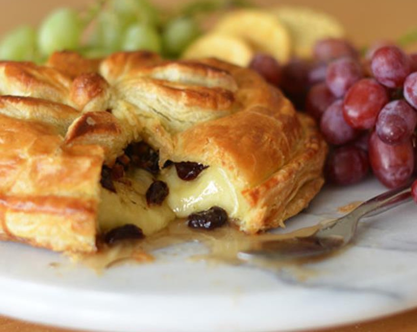 Baked Brie en Croûte with Honey, Dried Cherries, Rosemary & Pecans