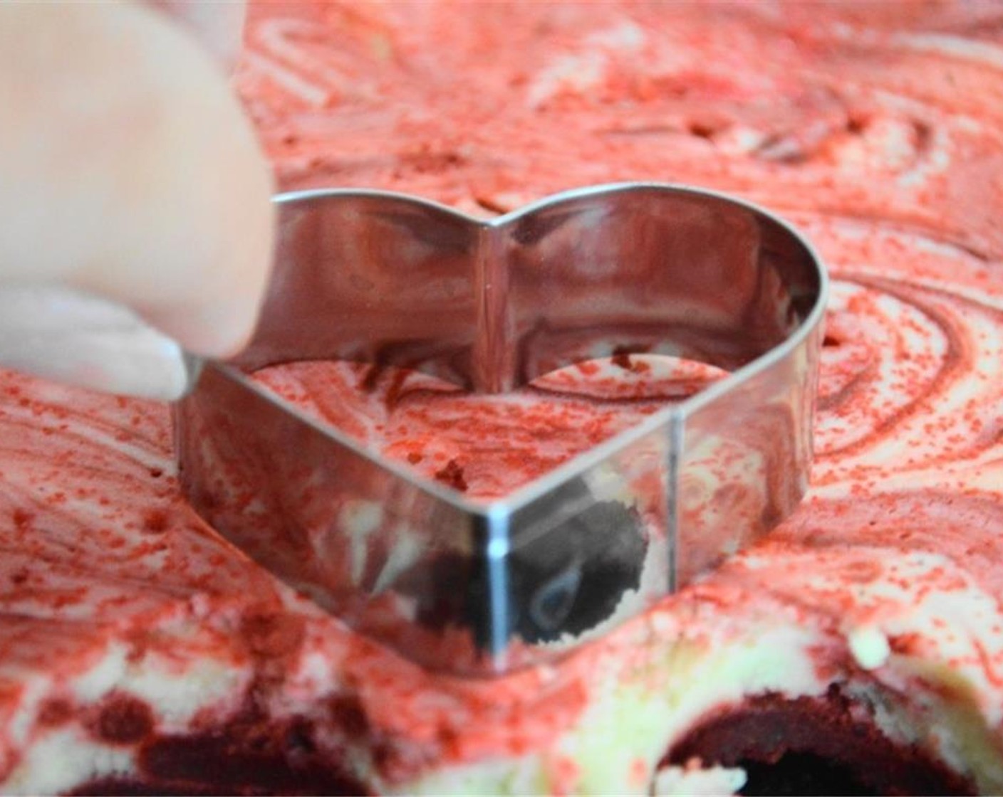 step 15 Grab a heart shaped cookie cutter that's about 2-3 inches wide at the widest part. Cut out heart shaped brownies as close together as possible to yield as many brownies as you can.