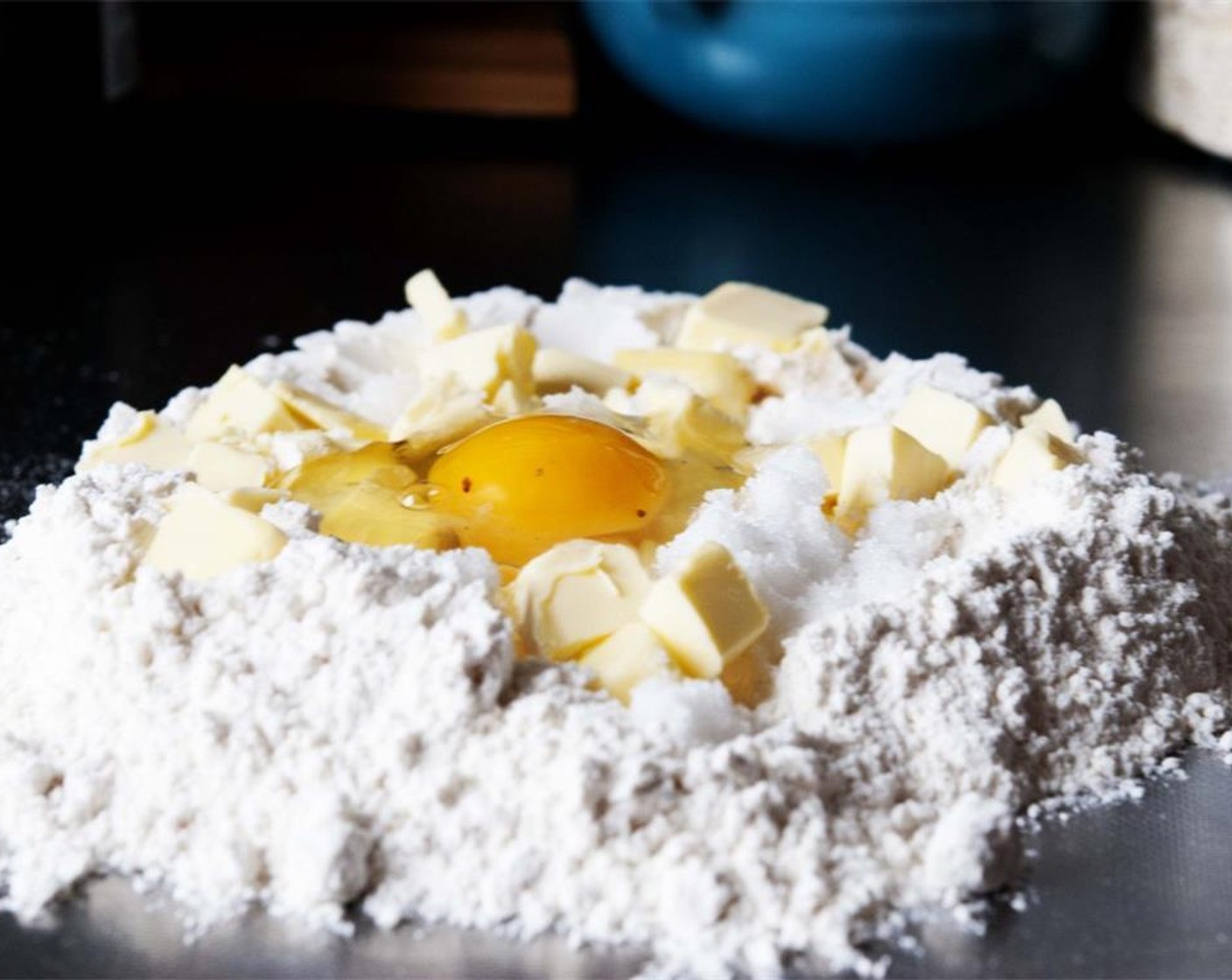step 6 For the crust, combine All-Purpose Flour (1 cup), Farmhouse Eggs® Large Brown Egg (1), Unsalted Butter (3 1/2 Tbsp). Granulated Sugar (1/4 cup), Baking Powder (1/2 tsp), and 1 tsp of zest from Lemon (1/8) on your kitchen counter.