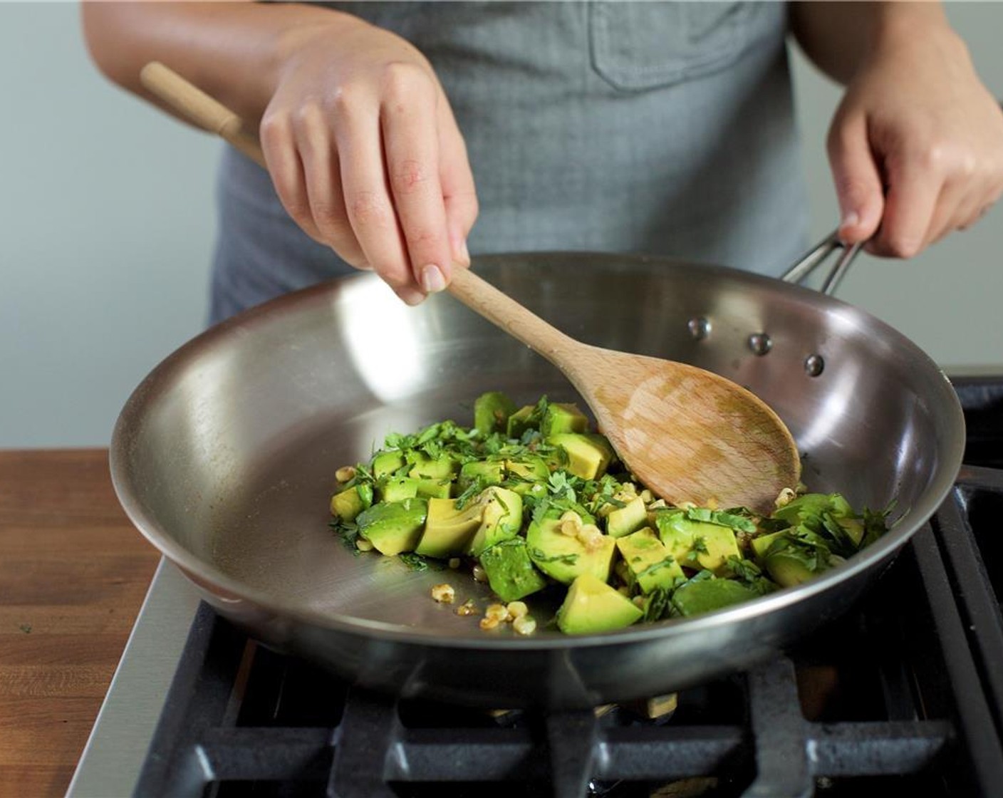 step 10 Turn the heat off, add the avocado, cilantro, and remaining lime juice, then set aside. Add the scallion to the quinoa and mix to combine.