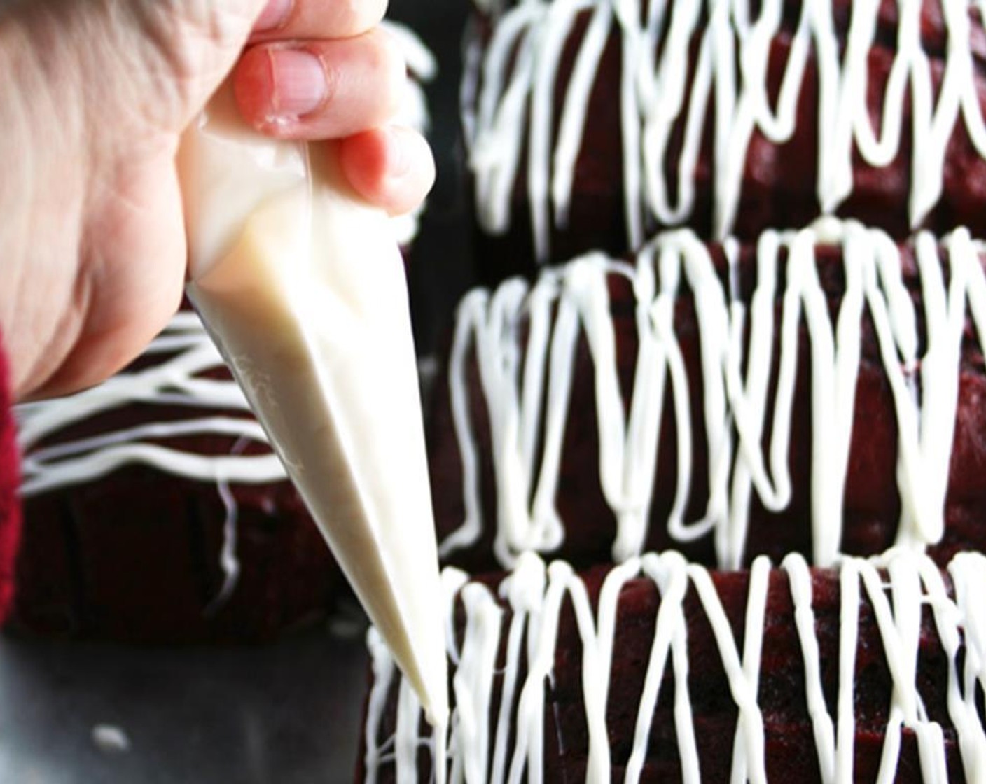 step 9 Pour into a clear plastic pastry bag. Cut the tip off and drizzle melted candy over the cooled bread.