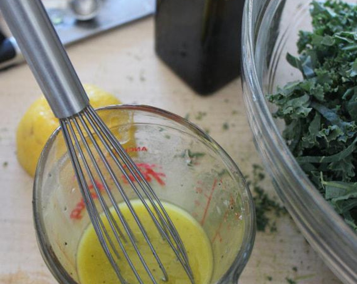 step 4 In a small, glass measuring cup, combine the juice from Lemon (1), Extra-Virgin Olive Oil (1/4 cup), Kosher Salt (3/4 tsp) andFreshly Ground Black Pepper (1/4 tsp). Whisk until smooth.