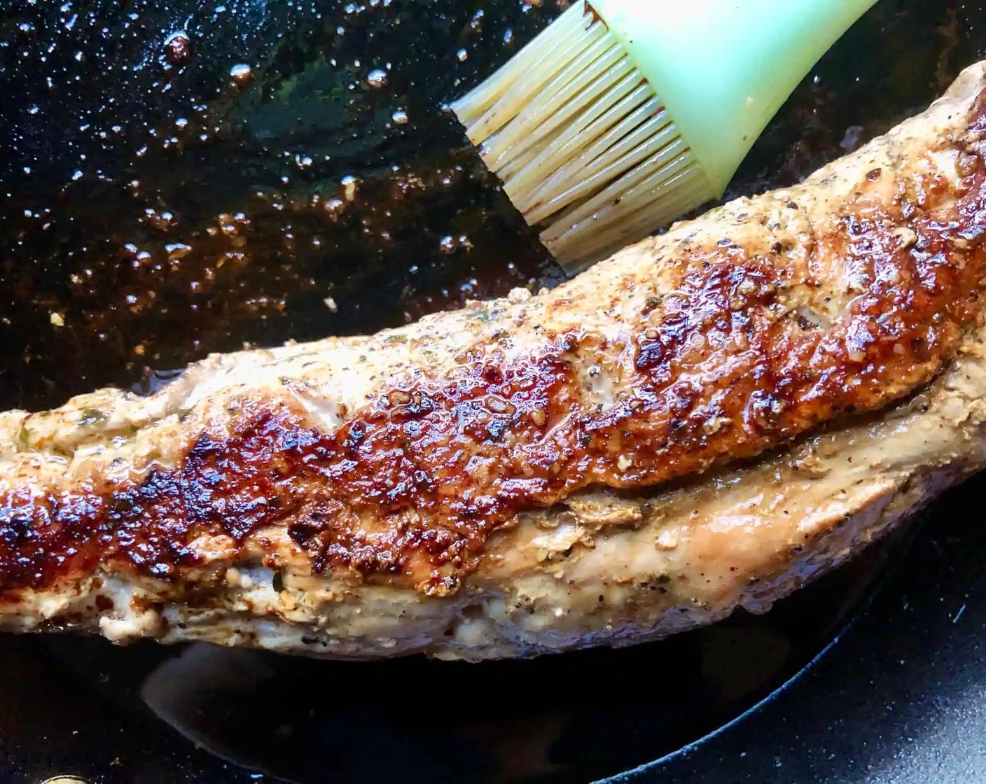 step 12 Once the oil is hot, place the tenderloin in the skillet (toothpick-side-down) and sear for about 2 minutes per side for a total of 6-8 minutes in all.