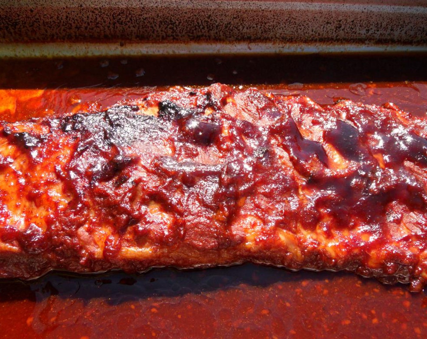 step 6 When the ribs are tender, remove the cover, raise the temperature to 400 degrees F (200 degrees C) and cook the ribs until nicely caramelized, about 15-20 minutes.