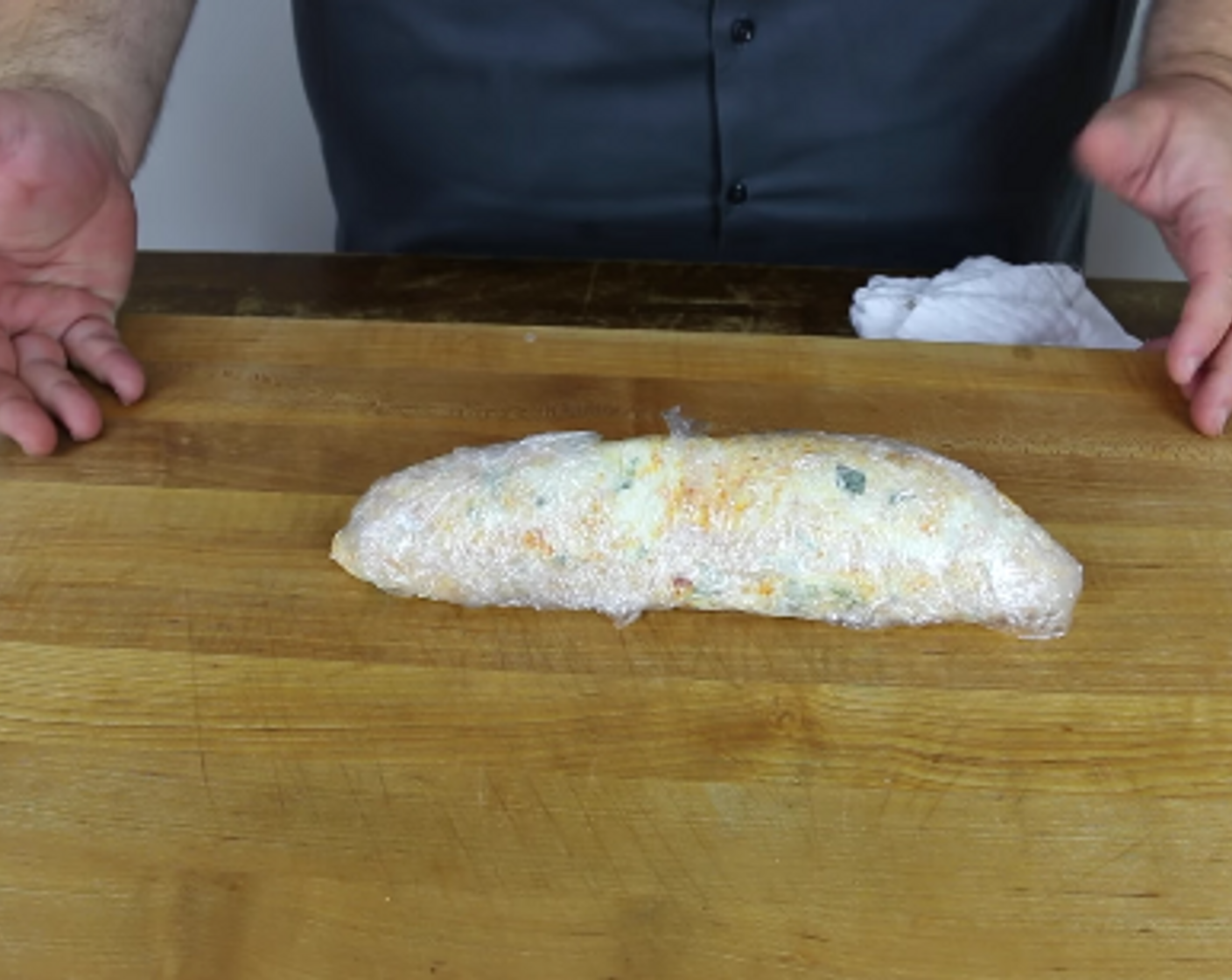 step 3 Place the cream cheese mixture on a sheet of plastic wrap and roll into a log shape. Refrigerate for 30 minutes. This can be done the day before to save time.