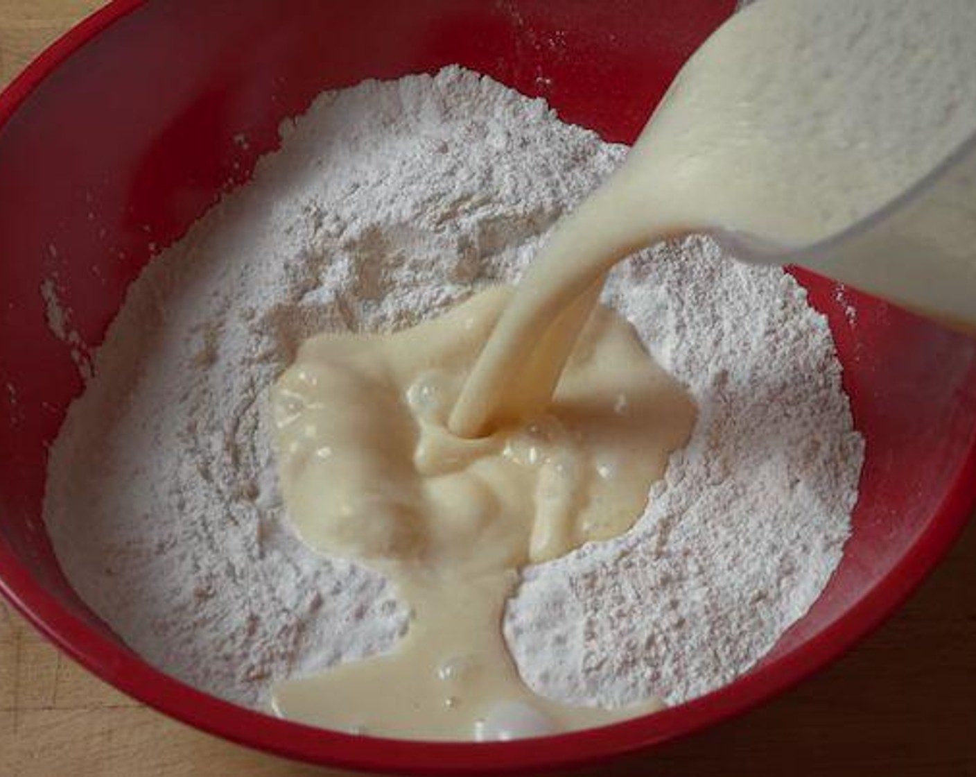 step 3 Back in the mixing bowl with dry ingredients make a well in the center and pour in the wet ingredients. Gently mix everything together until combined