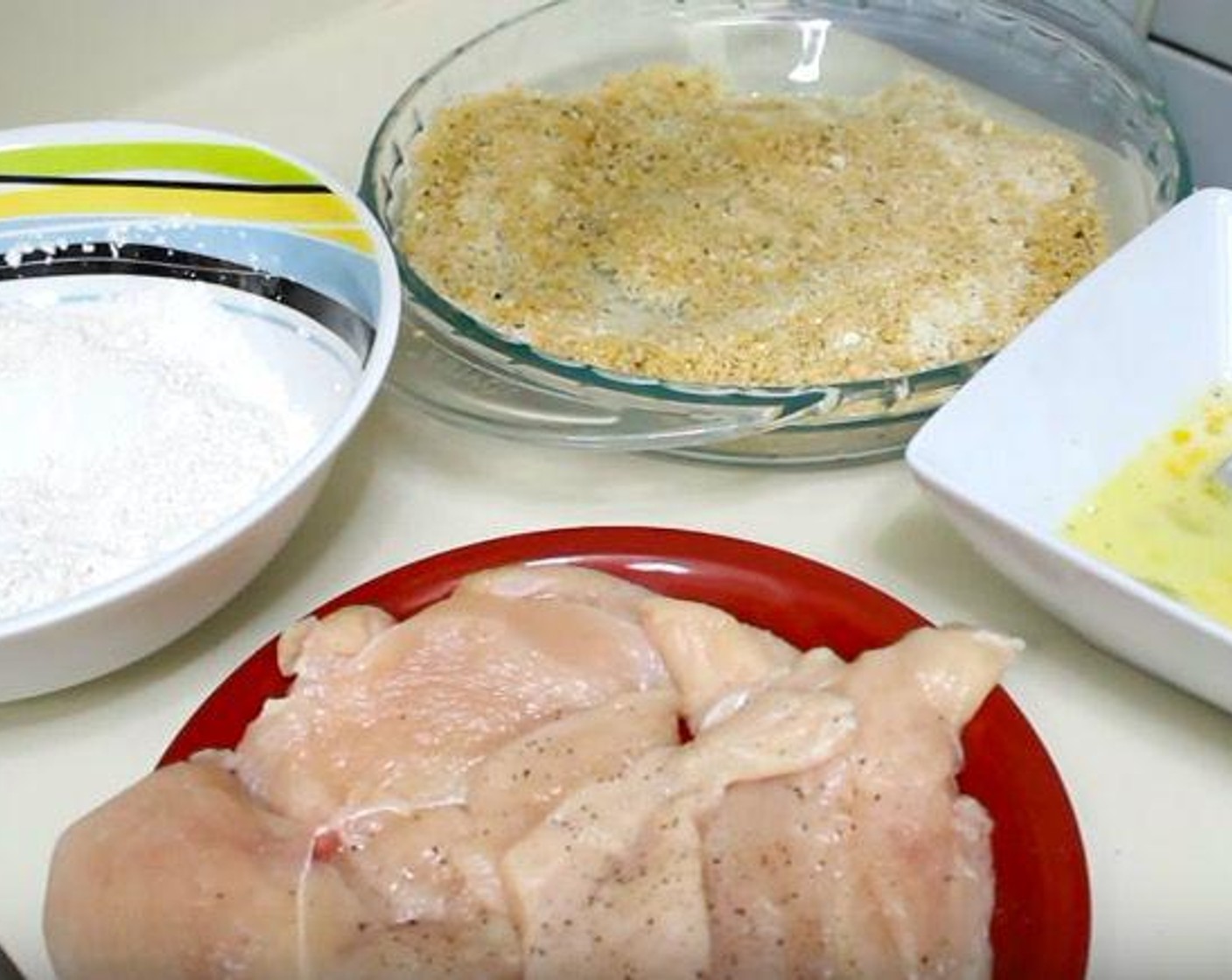 step 1 In a mixing bowl, add All-Purpose Flour (3/4 cup), Salt (to taste), and Ground Black Pepper (to taste). In another bowl, add Eggland's Best Classic Eggs (2), Milk (4 Tbsp), and additional salt and pepper and whisk together. In a final bowl, add Seasoned Panko Breadcrumbs (1 1/4 cups) and Parmesan Cheese (1/2 cup) and stir together.