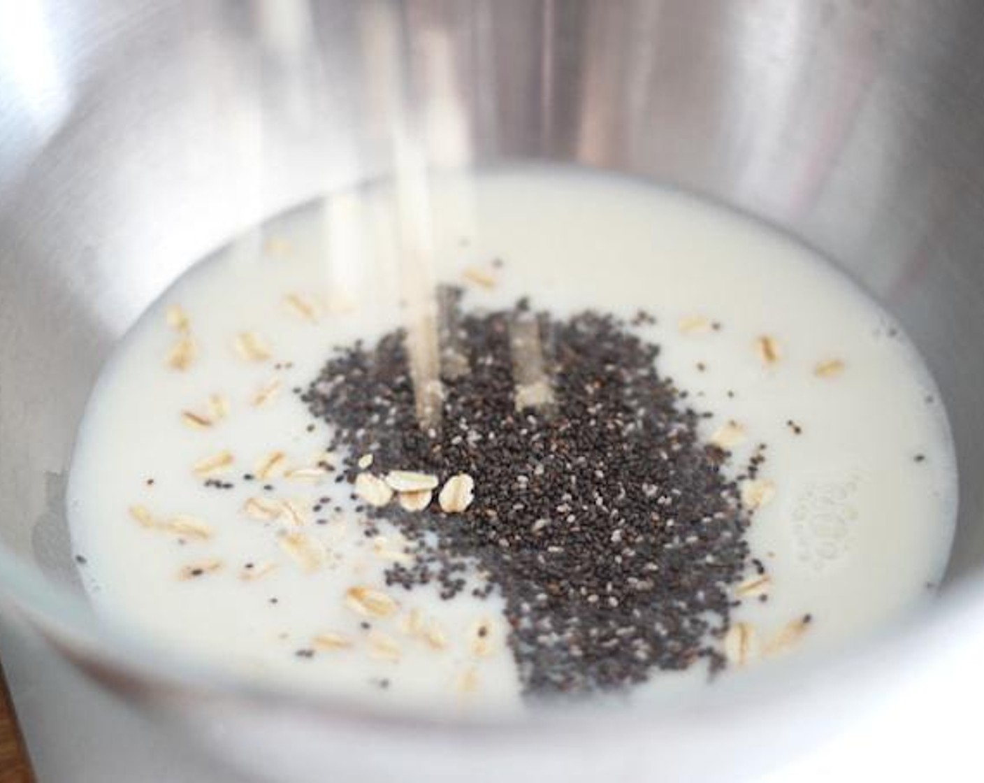step 4 In a bowl, whisk together the Soy Milk (2 cups), Old Fashioned Rolled Oats (1/2 cup), and Chia Seeds (2 Tbsp). Place in fridge for 1 hour.