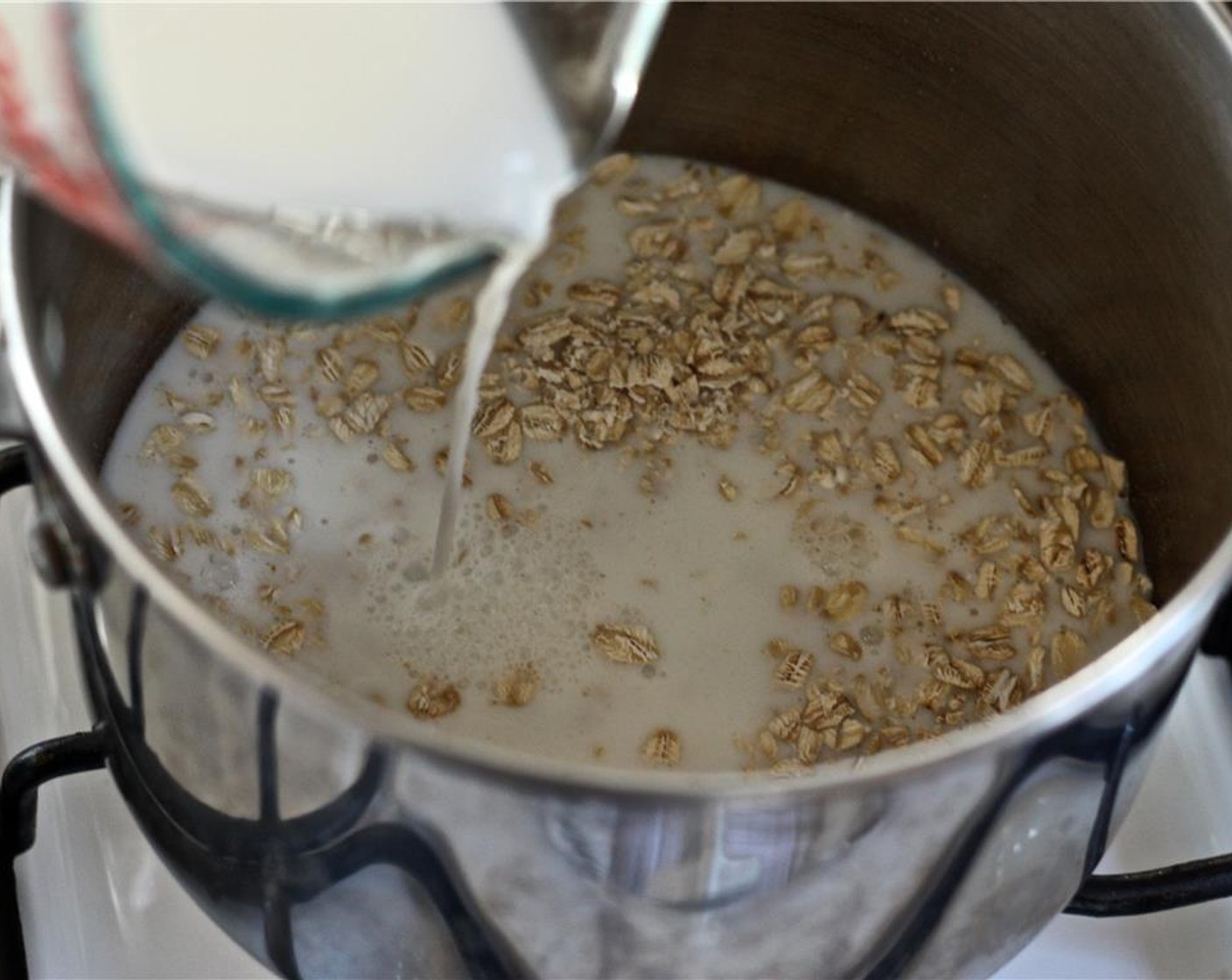 step 1 Combine the Milk (1/2 cup), Water (1/2 cup), Quick Cooking Oats (1/2 cup), Vanilla Extract (1/4 tsp), and Salt (1/8 tsp) in a medium pot. Bring to a boil, then reduce to a simmer and whisk for about 3-5 minutes, until the mixture begins to thicken.