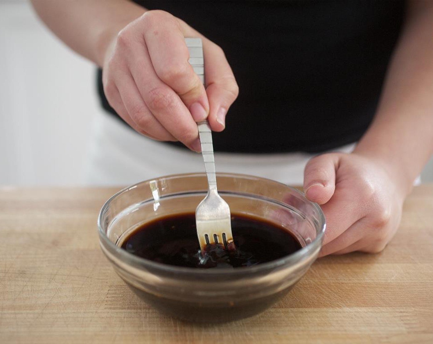 step 6 In a small bowl, combine the ginger, garlic, Tamari Soy Sauce (1/4 cup), Sambal (1/2 Tbsp), Rice Vinegar (1/2 Tbsp), and Sweet Soy Sauce (1/4 cup). Stir to combine; hold.