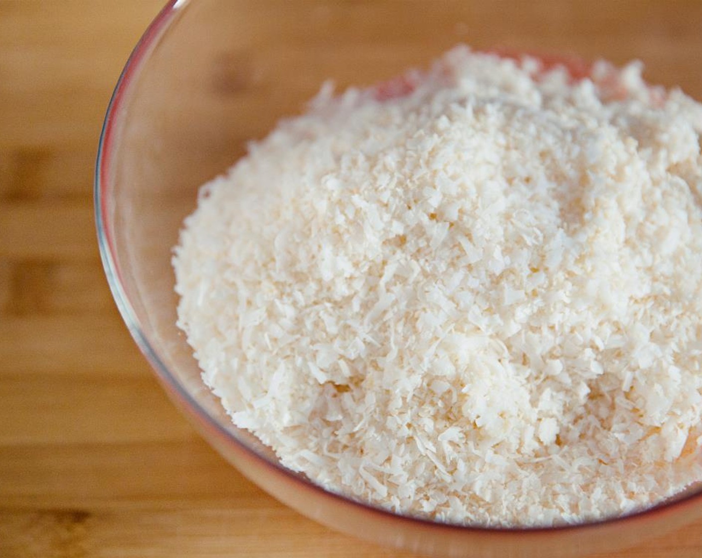 step 2 Add half of the Unsweetened Shredded Coconut (4 cups) to the bowl.