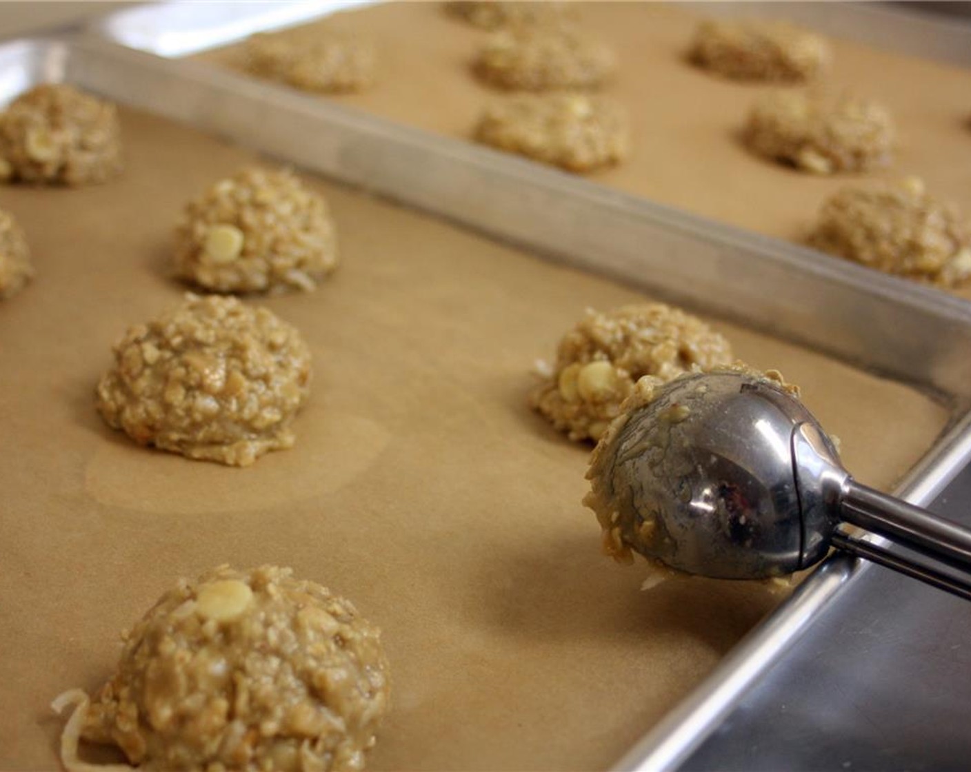 step 7 Scoop out about 3 tablespoon of dough per cookie onto the parchment lined cookie sheets.