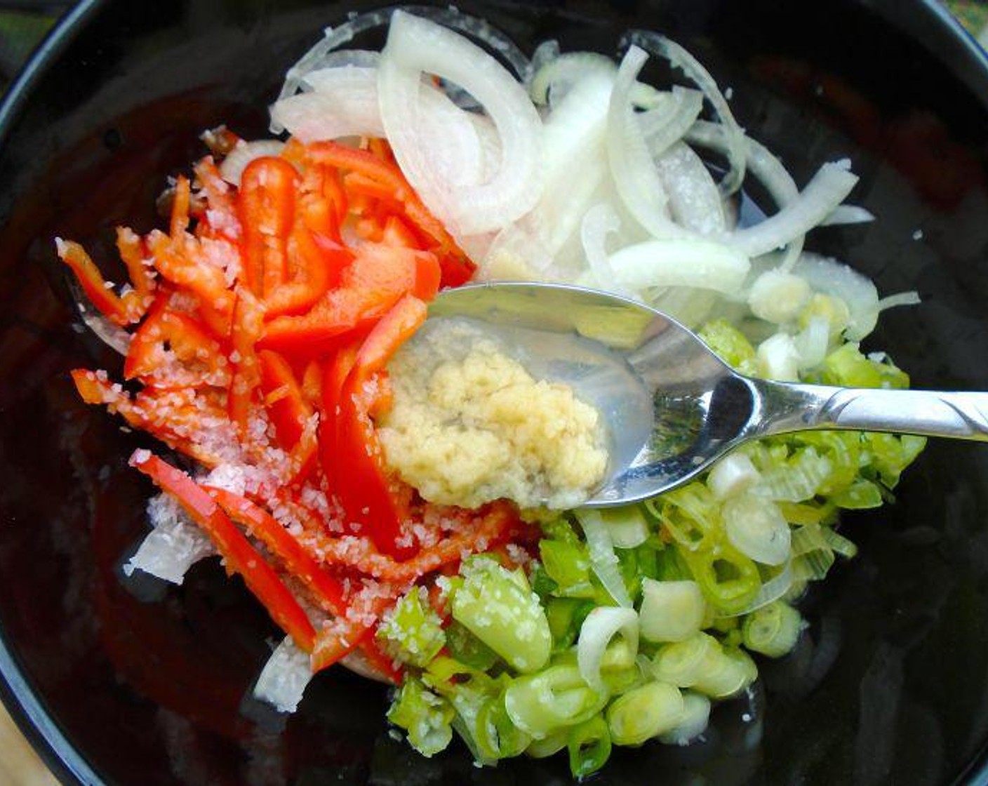 step 2 Mix Onions (to taste), Red Bell Peppers (to taste), Scallions (to taste), Distilled White Vinegar (to taste), Garlic Oil (to taste), Kosher Salt (to taste), and a bit more garlic paste. Let marinate at least 2 hours.