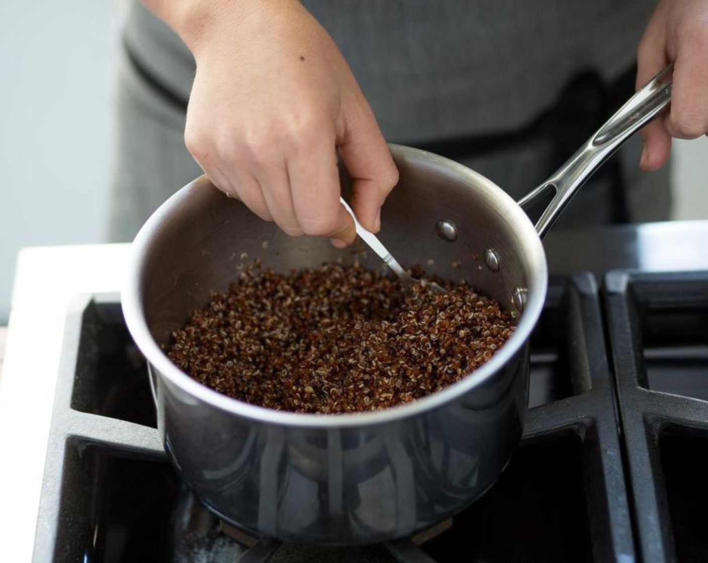 step 3 In a small saucepot over medium-high heat, bring Water (1 1/2 cups) to a boil. Add the Red Quinoa (2/3 cup), McCormick® Garlic Powder (1 tsp), Salt (1/4 tsp) and only HALF of the lime juice and HALF of the Chili Powder (1/4 tsp). Stir to combine.
