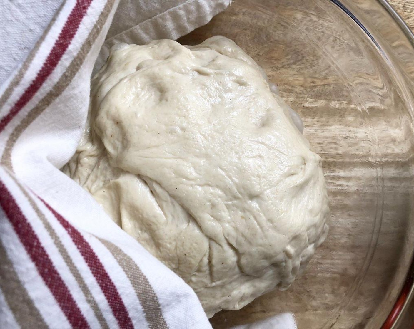 step 2 Place the Pizza Dough (1) in the bowl and turn to coat all sides. Cover with a clean cloth and place it in a warm place to prove for about 30 minutes until doubled in size.